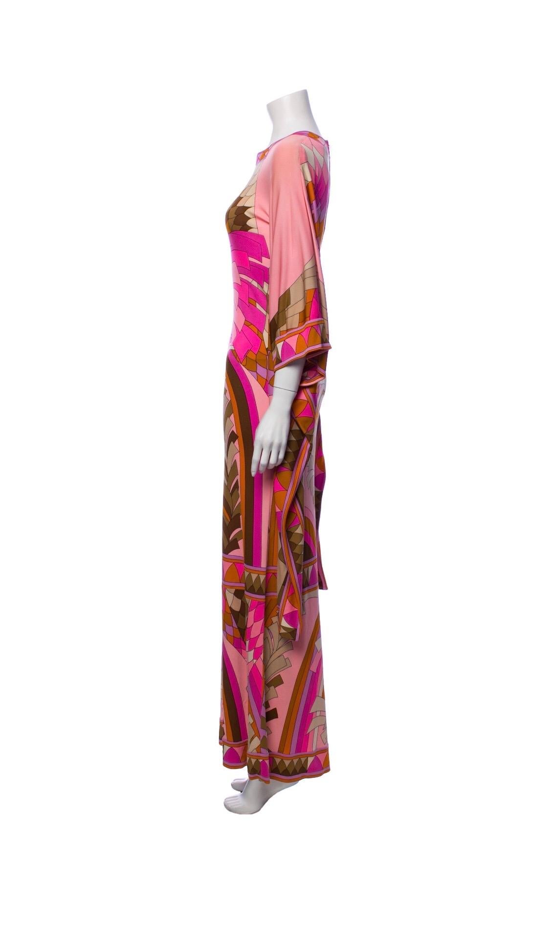 A beautiful 1970s Leonard Paris dress with some Pucci inspiration! Made from soft Silk Jersey, this maxi dress features a multi-colored geometric print with beautiful angel wing sleeves. Perfect for a day or night out, this dress will pair perfectly