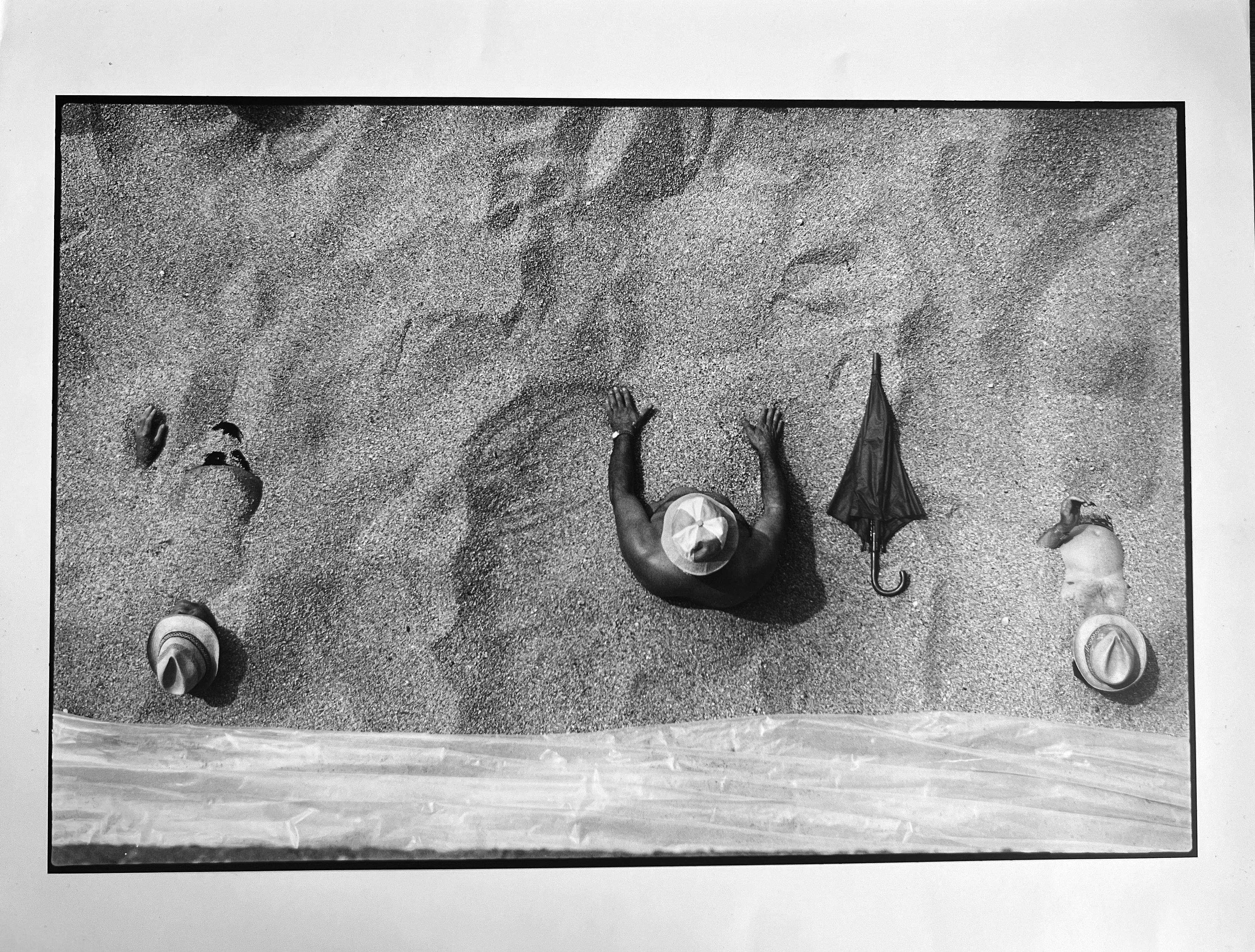 Beach II, Italy, 1984 by Leonard Freed is an 11" x 14" black and white photograph, a gelatin silver RC press print from the Freed archive, signed verso (on back of photograph) by the photographer, stamped/authenticated vintage print by the Freed