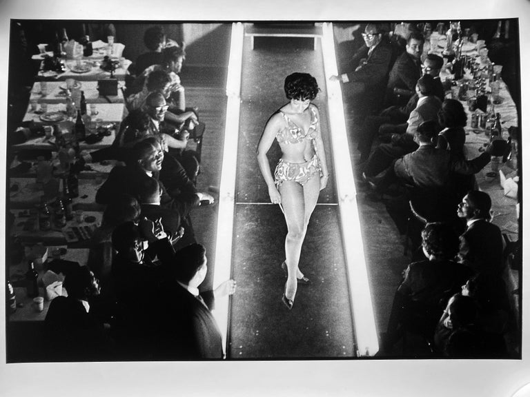 Beauty Contest, Harlem, 1963 by Leonard Freed is a 16" x 20" gelatin silver print, signed verso (on back) by the Freed estate. The image appears in American photographer Freed's seminal photo book Black in White America, page 106.

Predating Fashion