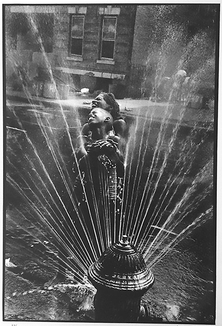 Fire Hydrant, Harlem, 1963 by Leonard Freed is a 19" x 13" limited edition photograph. The portrait is signed verso (back of photo) by the estate and Brigitte Freed wife of the photographer, with Leonard's Freed's Magnum stamp (photo back).

In the