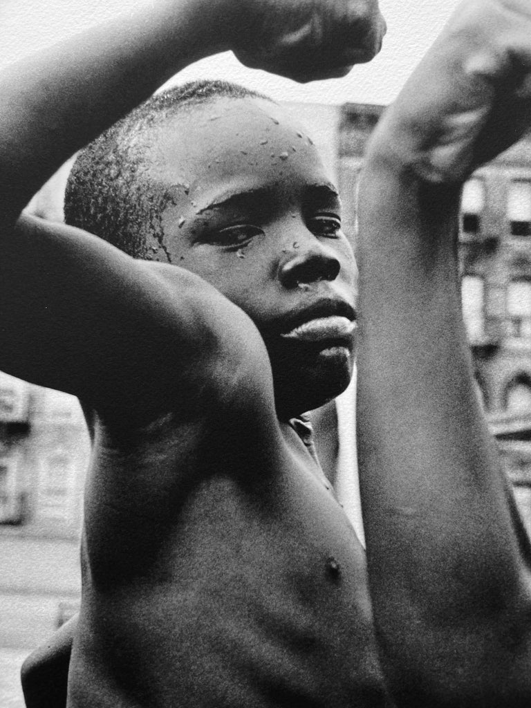 Muscle Boy, New York City, Portrait of African American Children in Harlem - Photograph by Leonard Freed
