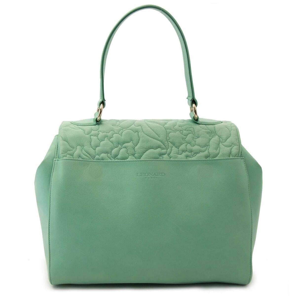 Excellent condition

Leonard Mint Green Top Handle Handbag

Pastel colors can be worn in winter aswell as in summer. So this bag is an all year around purse.
The font flap has a sowing pattern of flowers.
Put all your daily essentiels in this