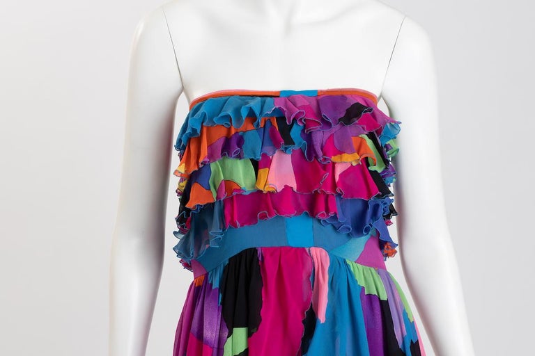 Vintage Leonard of Paris bright and flirty ruffled silk chiffon cocktail dress / evening gown, unmarked size, approximately US 6.
Featuring four layers of ruffled bodice, and a chiffon sash belt that ties at waist. 
 Dress bodice top has a hand