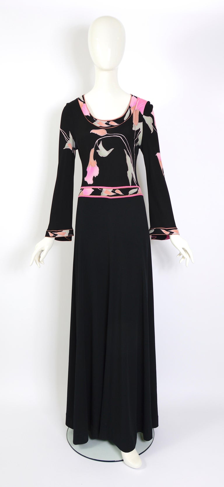 Signed Leonard Paris 1970s vintage maxi dress featuring bell sleeves and made in a botanical printed 100% silk jersey.
The dress is labeled size 4 but can accommodate a variety of sizes due to the stretch. 
Our doll is a french size 36 and the dress