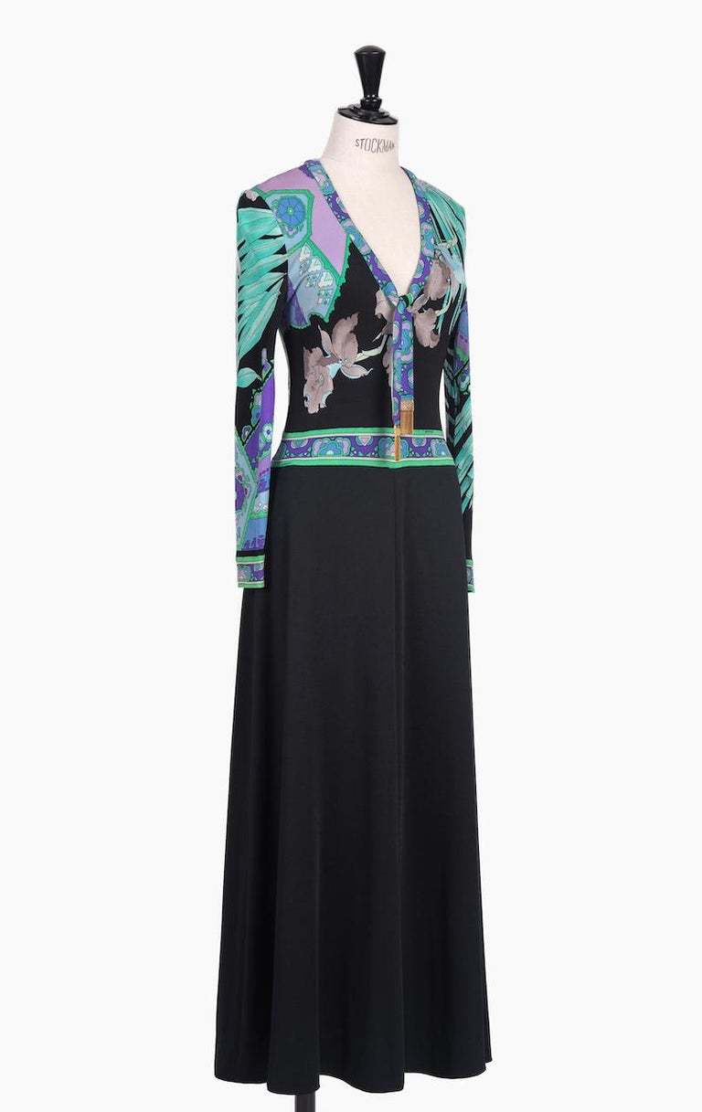 This is a stunning 1970s Leonard Fashion Paris maxi dress with one of their iconic vibrant floral prints covering the top. I love the flattering V-neckline with the signature contrasting trim that ends in ties that are finished with signed gold gilt