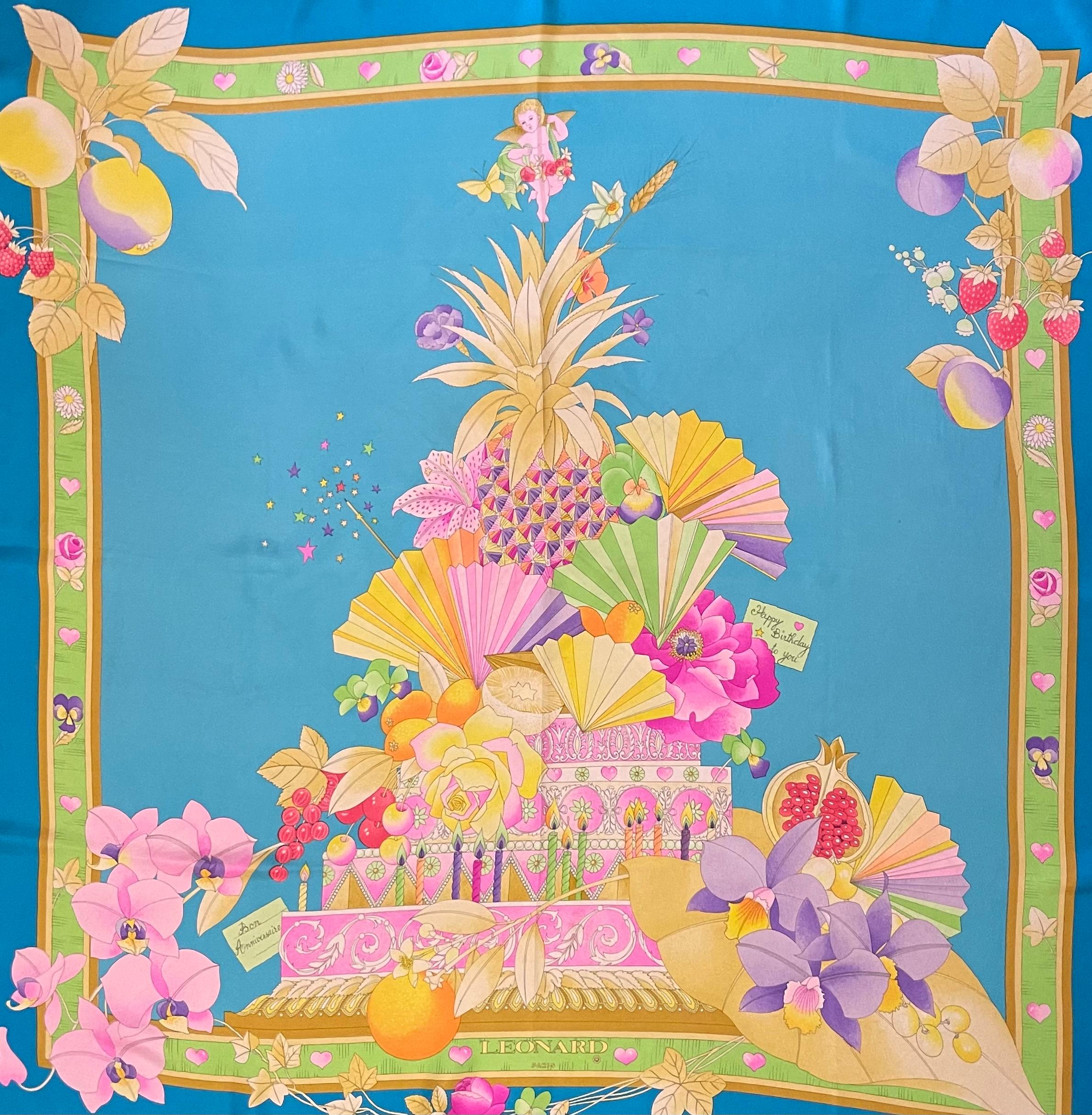 Pañuelo de seda Léonard Paris. Este precioso pañuelo tiene colores vibrantes y vistosos, perfecto para el verano o la primavera. Esta marca representa realmente la fascinación de las marcas por todo lo floral y colorido. 
En buen estado. 
34in x