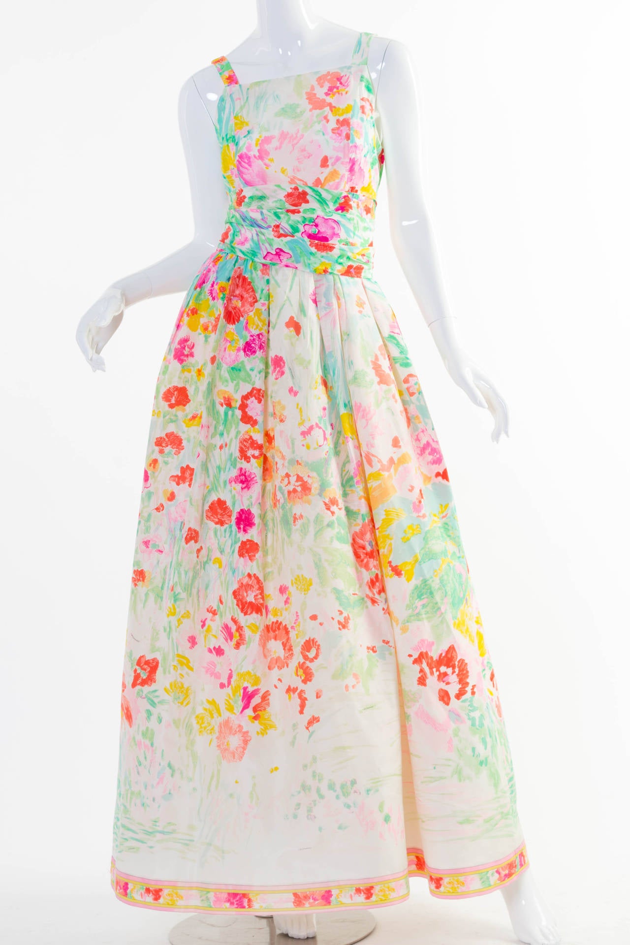 This gown arrives just in time for Spring. It’s not only the consummate garden party (or garden wedding) ensemble, but also a lovely example of why Leonard Paris has been sought out for its colorful textiles since its founding in 1958. The silk maxi