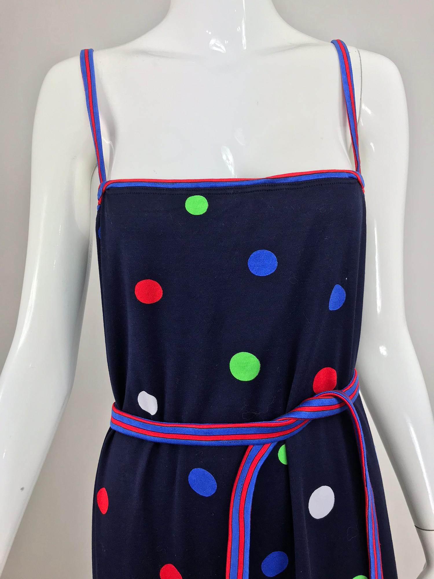 Leonard Paris polka dot cotton knit sun dress from the 1980s. The perfect dress for sunny days, Cotton knit dress in dark dark blue with bright polka dots scattered throughout. Pull on dress has cased elastic at the bodice upper edge, narrow