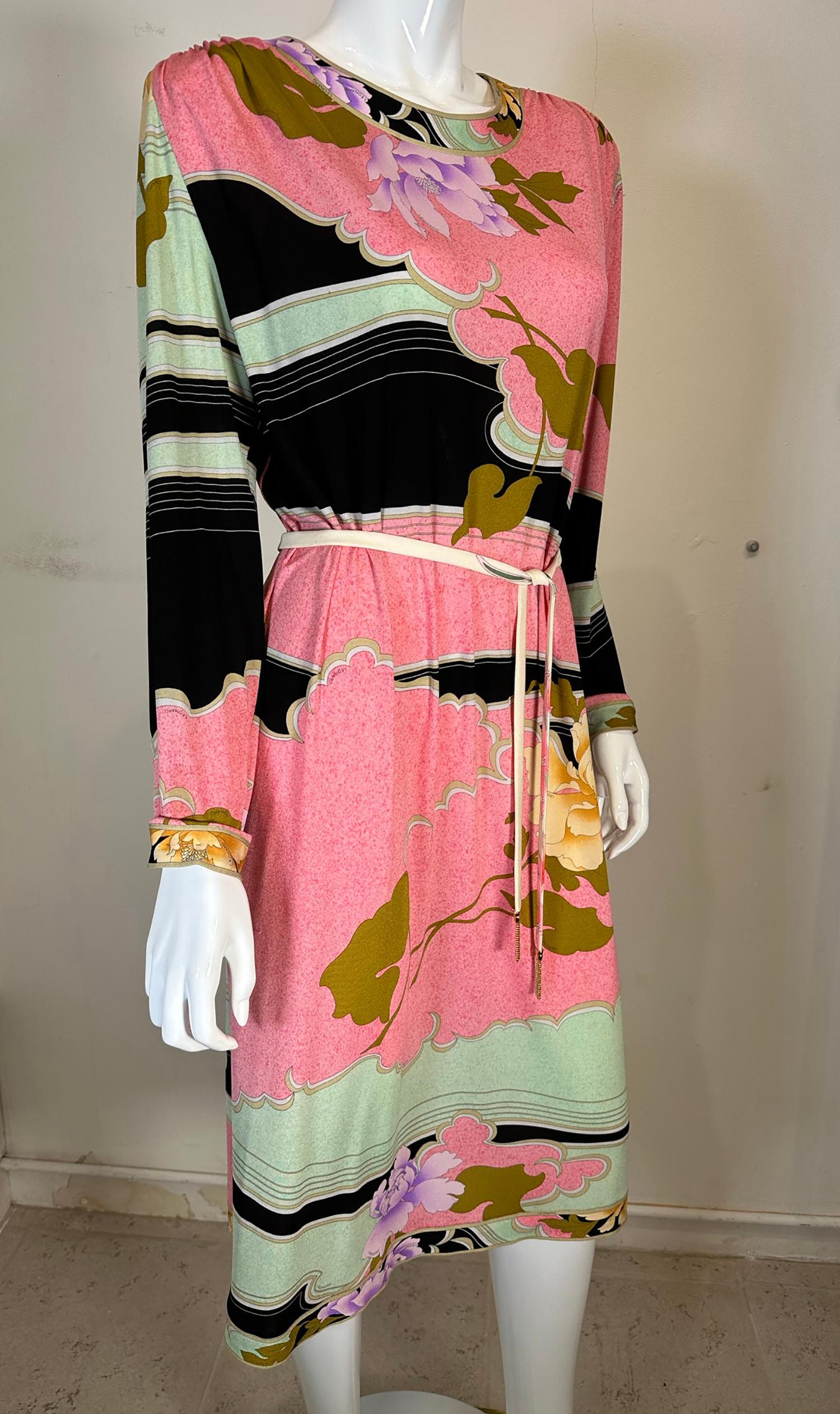 Leonard Paris silk jersey floral print long sleeve shift dress with belt marked size 48.
Pull on dress, with gold tipped self belt, long sleeves. 
In excellent wearable condition. All our clothing is dry cleaned and inspected for condition and is