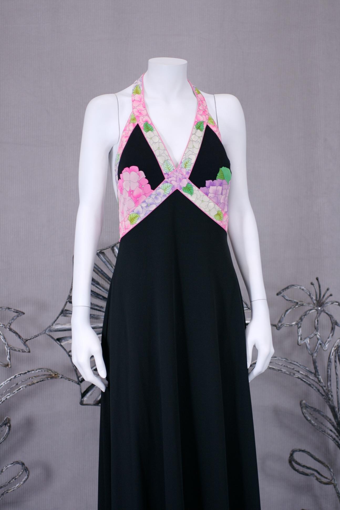 Sexy Leonard Paris Silk Jersey Halter Dress in black with iconic Leonard pattern placements. Floral hydrangea bands and motifs are used throughout for a simple but dramatic look. 
1970's France. Small size. 2-4. 