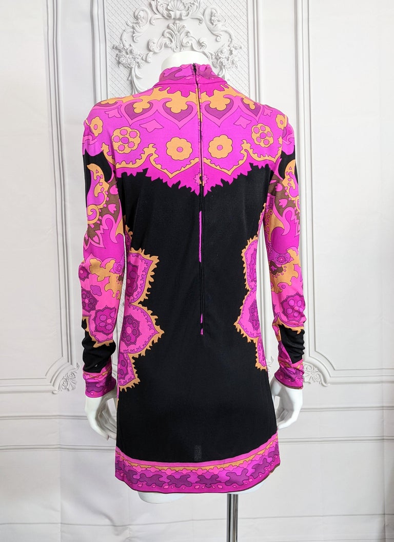 Cool Leonard, Paris Silk Jersey Mini Dress with custom print placement. Black base with colorful hot pink, purple and orange floral patterning and matching silk jersey tube belt. 
Back zip entry. Size 1 Leonard. Modern size 0-2. Silk Jersey. 1960's