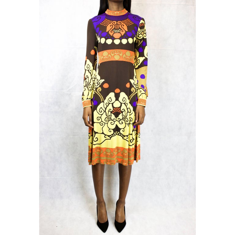 Leonard Paris Silk Jersey Dress

This dress is constructed from silk jersey printed with a orange, dark chocolate, light chocolate and mustard multi-coloured weave-like ethnic pattern. Ten small Leonard signatures are also printed onto the dress.
