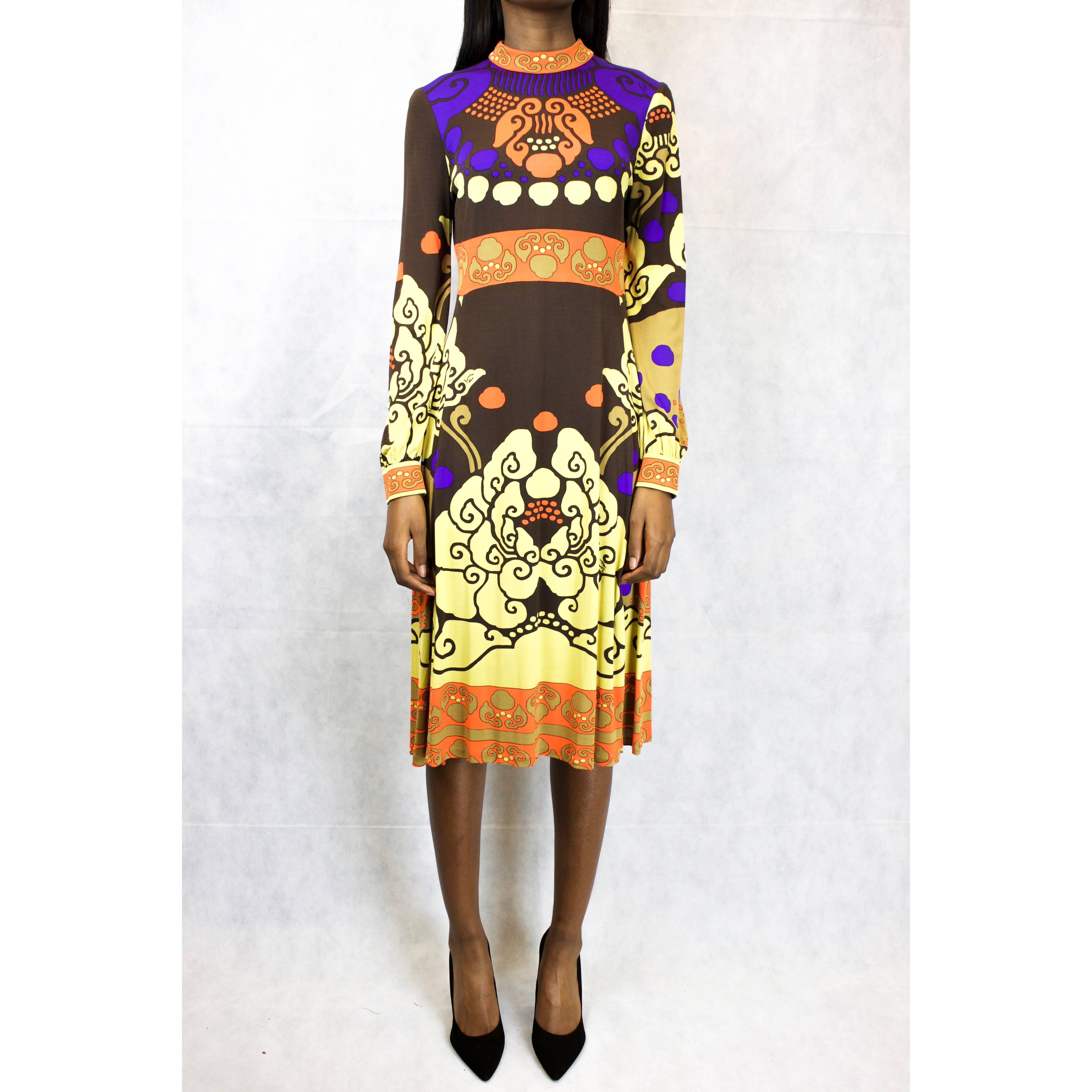 Leonard Paris Silk Jersey Dress

This dress is constructed from silk jersey printed with a orange, dark chocolate, light chocolate and mustard multi-coloured weave-like ethnic pattern. Ten small Leonard signatures are also printed onto the dress.