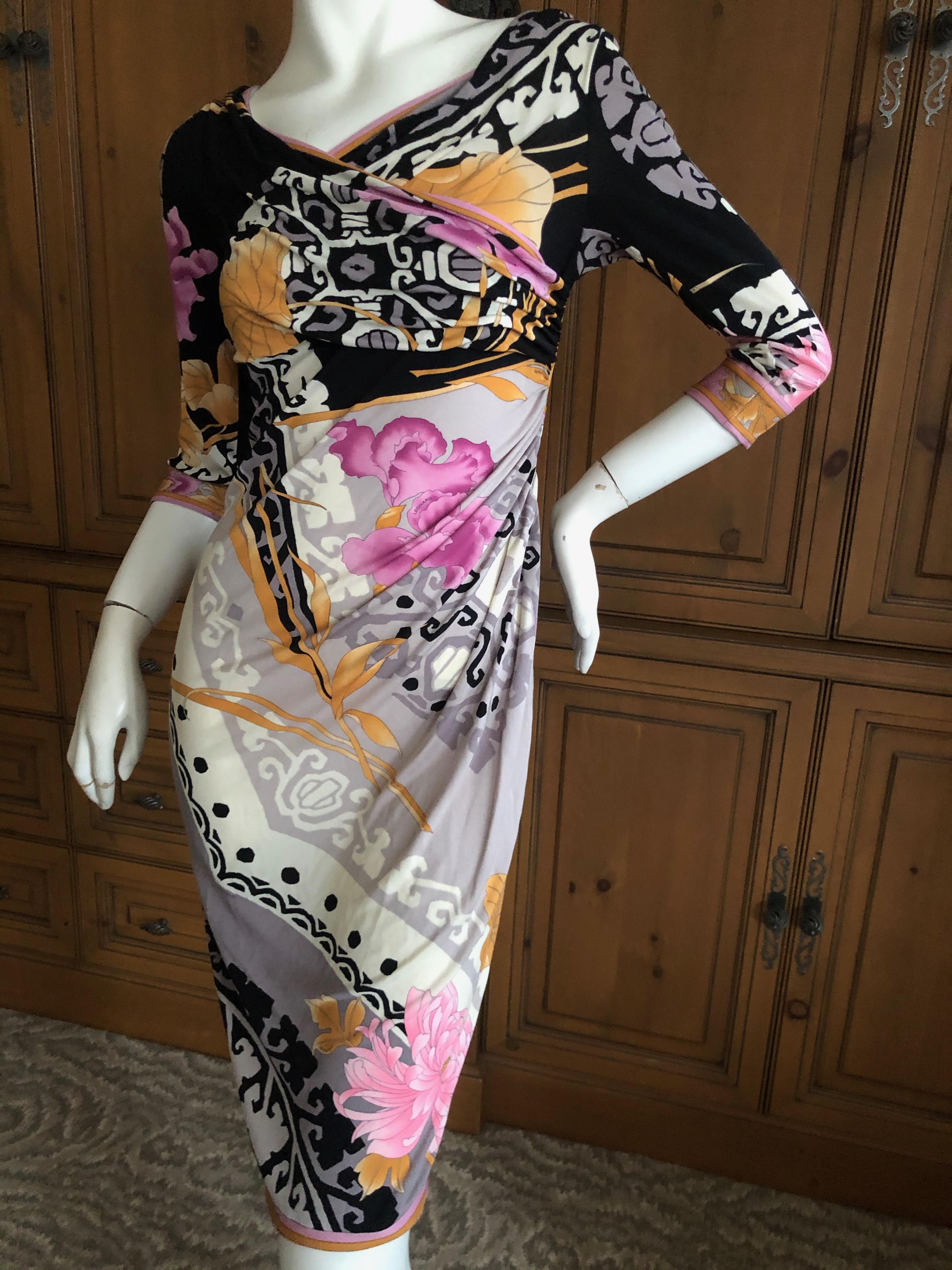 Leonard Paris Silk Jersey Vintage Floral & Aztec Pattern Shirred Cocktail Dress.
I think the bust might have been sewn up a little for modesty, it was originally very very low cut.
Leonard Paris was a contemporary of Pucci, both houses creating