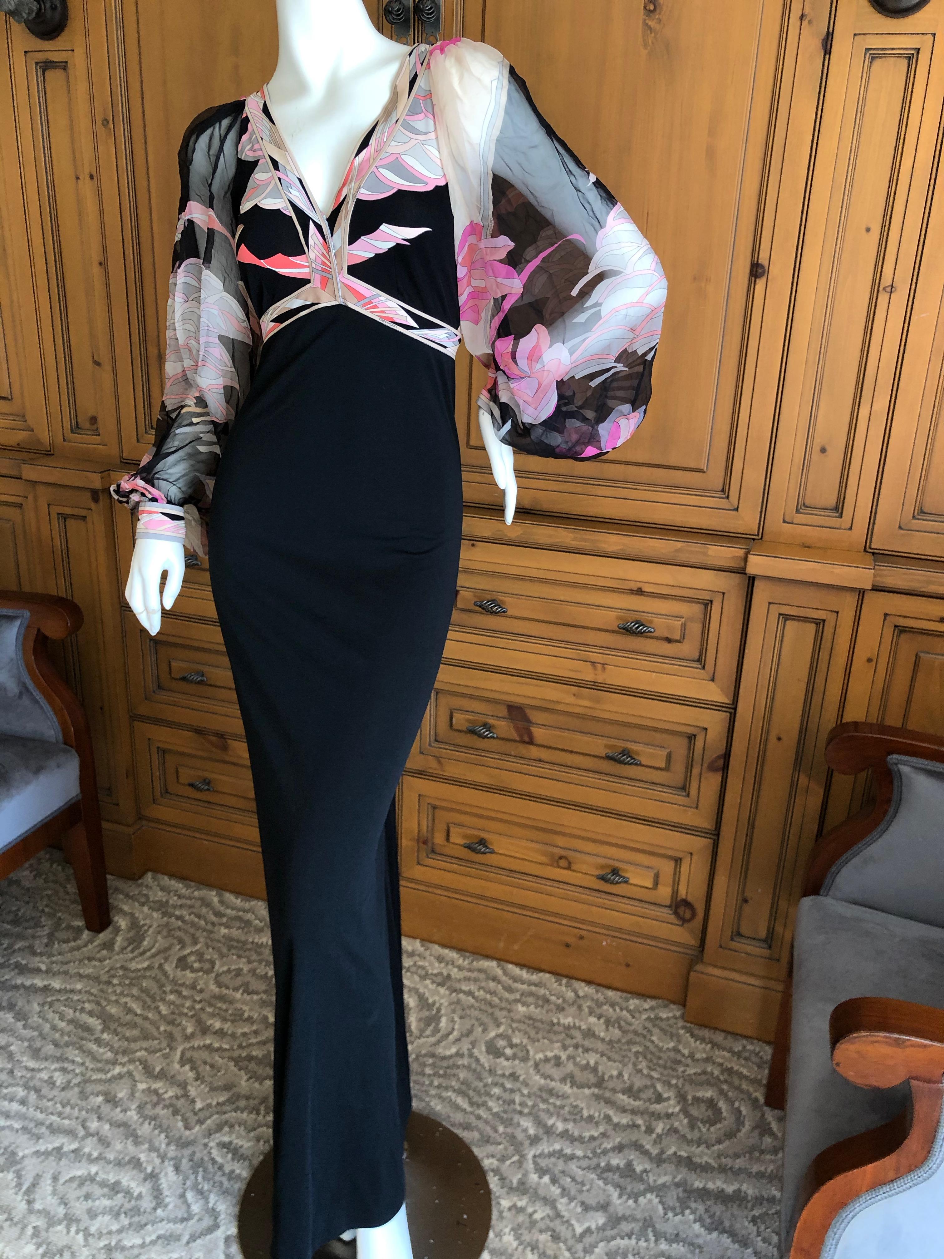 Leonard Paris Silk Jersey Vintage Long Evening Dress with Sheer Poet Sleeve .
I think the bust might have been sewn up a little for modesty, it was originally very very low cut.
Leonard Paris was a contemporary of Pucci, both houses creating