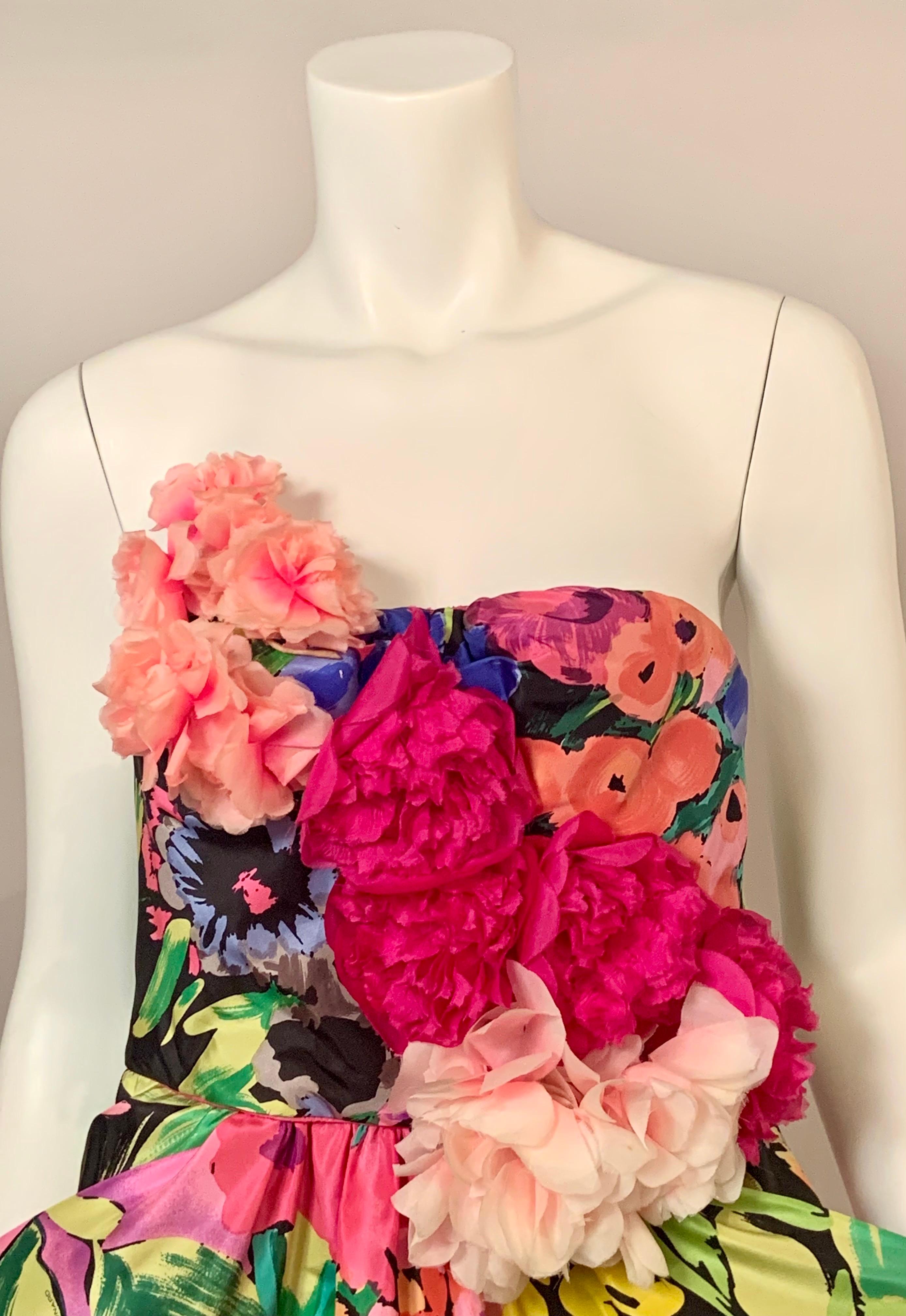 This strapless dress from Leonard, Paris is just so cheerful and feminine.  The floral print seems to have every shade of every color under the rainbow set against a black background.  There is even a great border print at the hemline.  The bodice