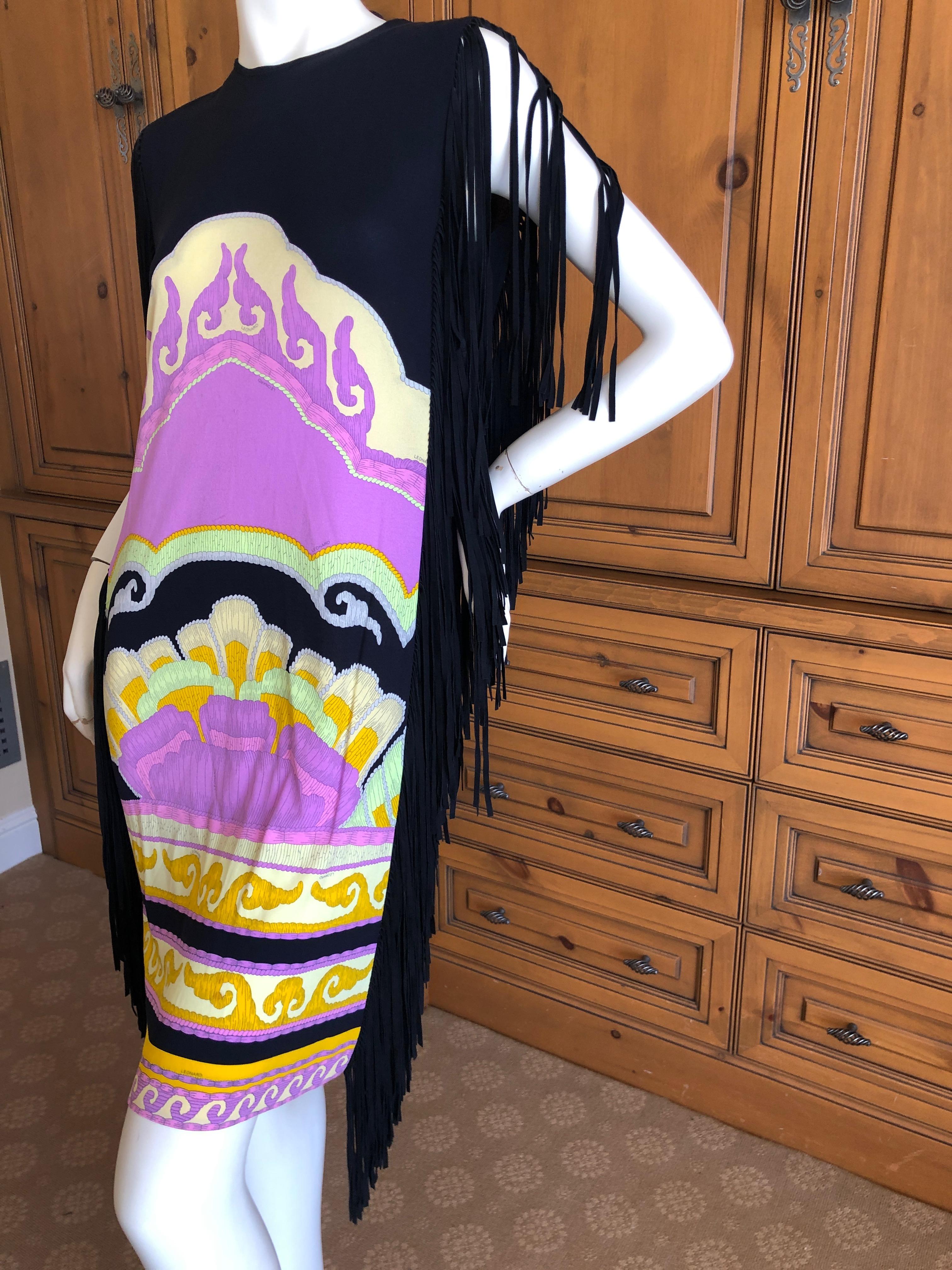 Leonard Paris Vintage Silk Jersey Sleeveless Dress with Suede Fringe Details.
There is also a belt with suede fringe.
Leonard Paris was a contemporary of Pucci, both houses creating brilliant 60's patterns on silk jersey.
 Both were very expensive,