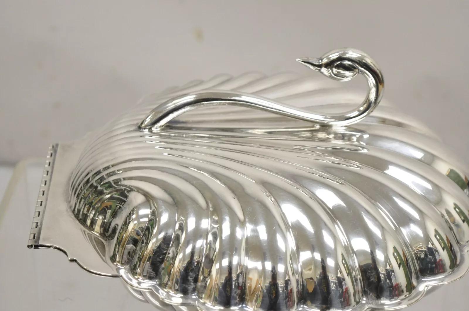 Leonard Regency Style Silver Plated Clam Shell Hinged Warmer with Swan Handle. Item features a swan handle, raised on three feet, large hinged form, original hallmark. Circa Mid 20th Century. Measurements: 8
