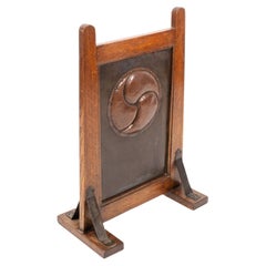 Leonard Wyburd, attri. A Rare Arts & Crafts Oak Fire Screen by Liberty & Co