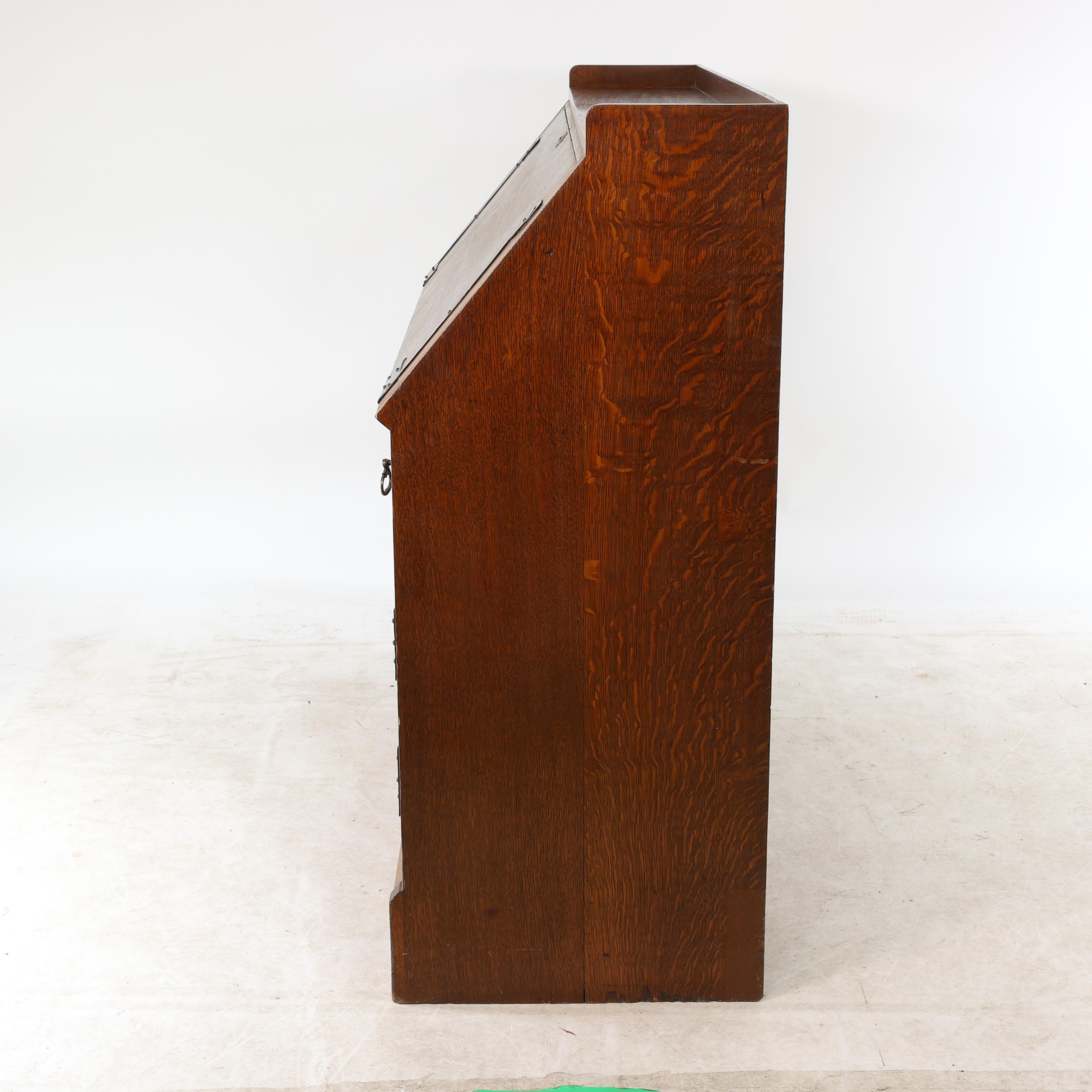 Leonard Wyburd for Liberty & Co. An Arts & Crafts oak bureau with iron hinges For Sale 3