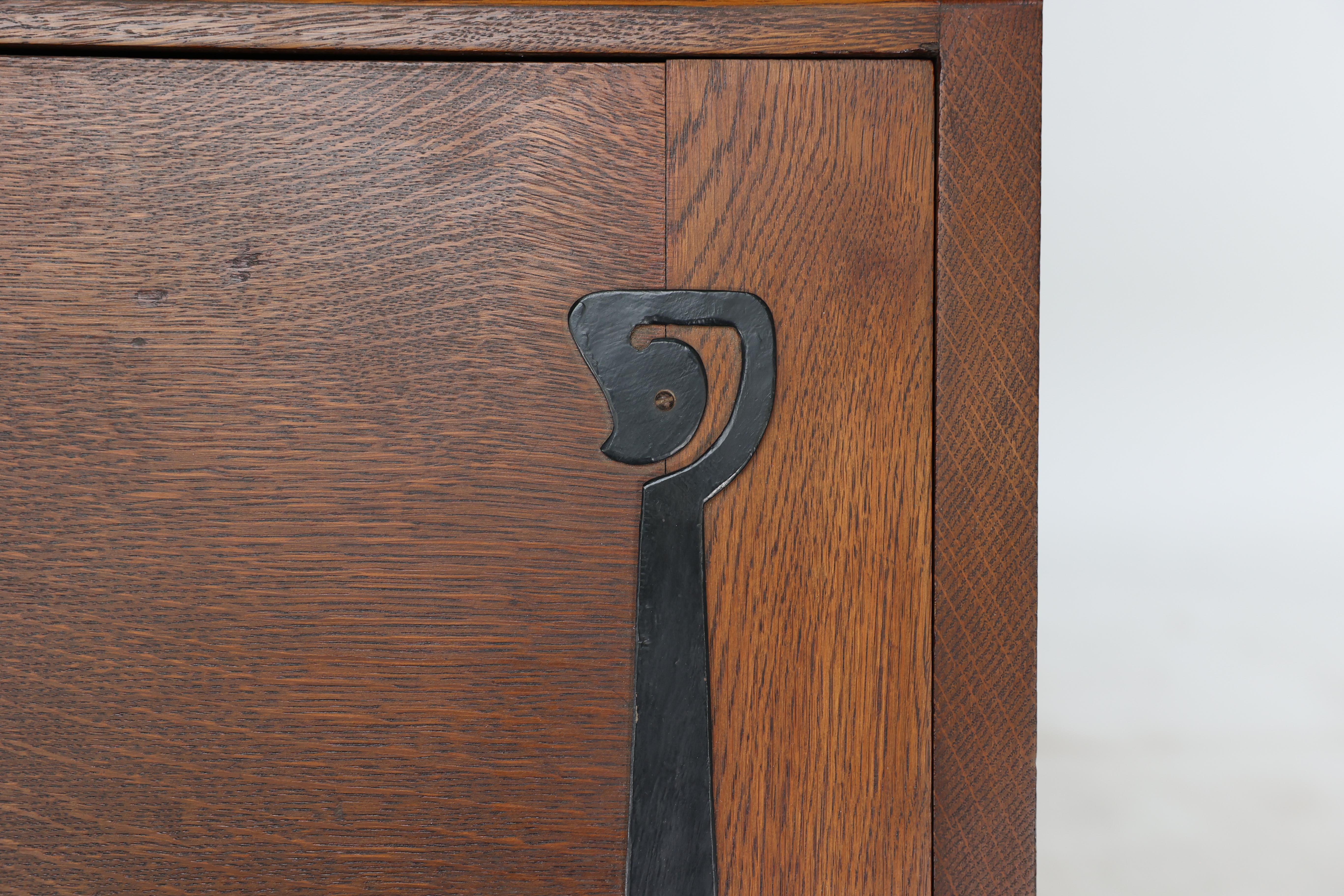 Leonard Wyburd for Liberty & Co. An Arts & Crafts oak bureau with iron hinges For Sale 5