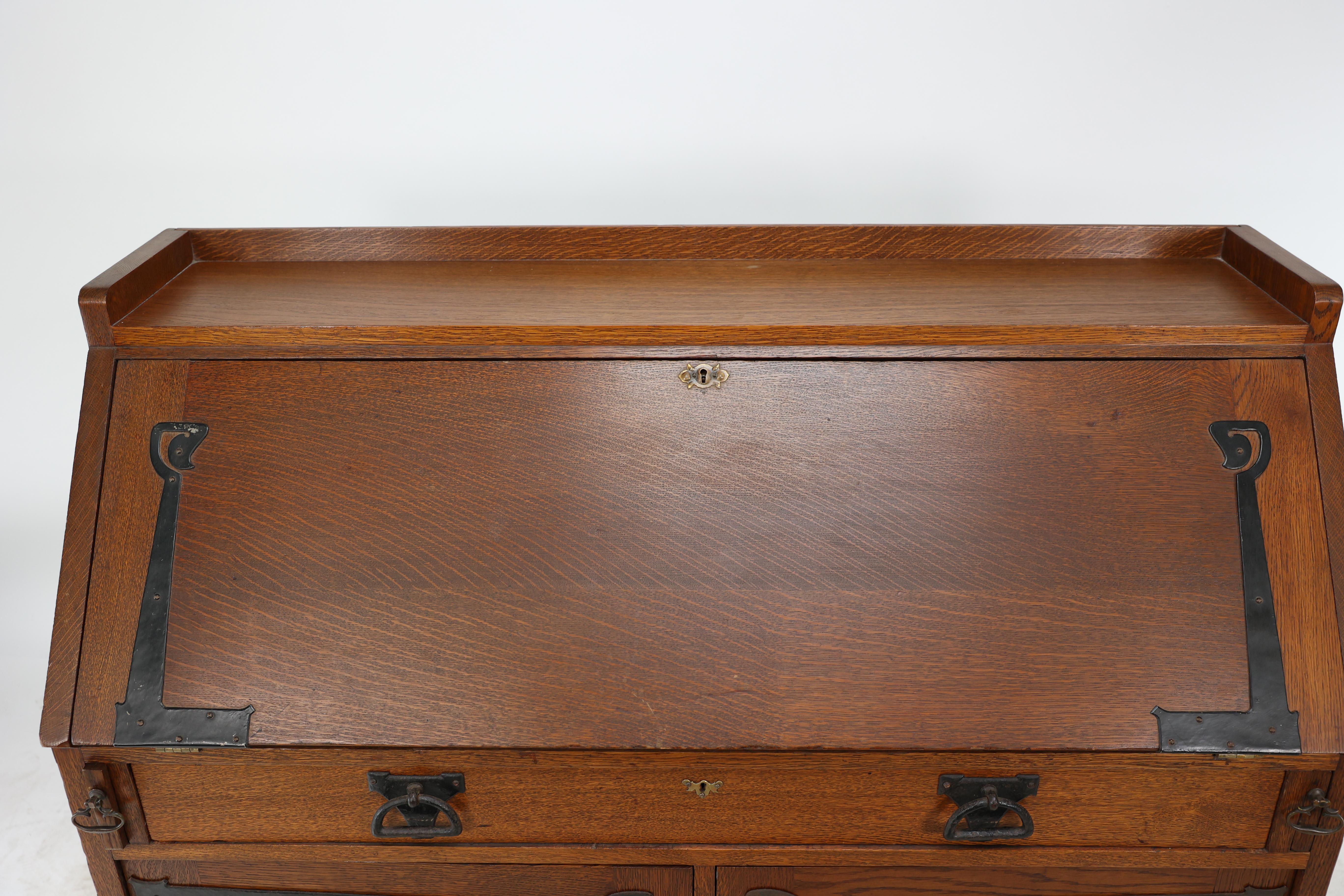 Leonard Wyburd for Liberty & Co. An Arts & Crafts oak bureau with iron hinges For Sale 7