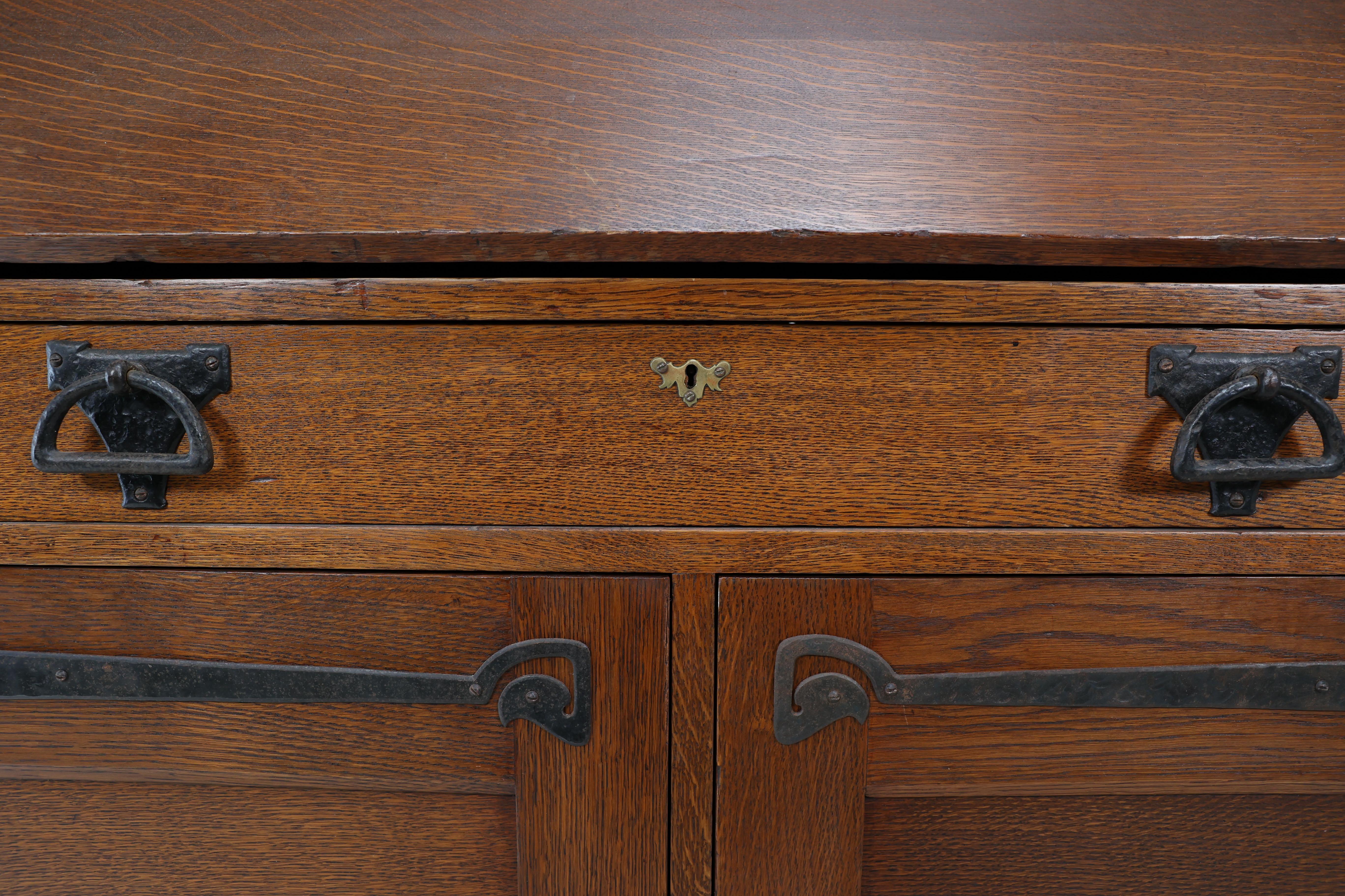 Leonard Wyburd for Liberty & Co. An Arts & Crafts oak bureau with iron hinges For Sale 8