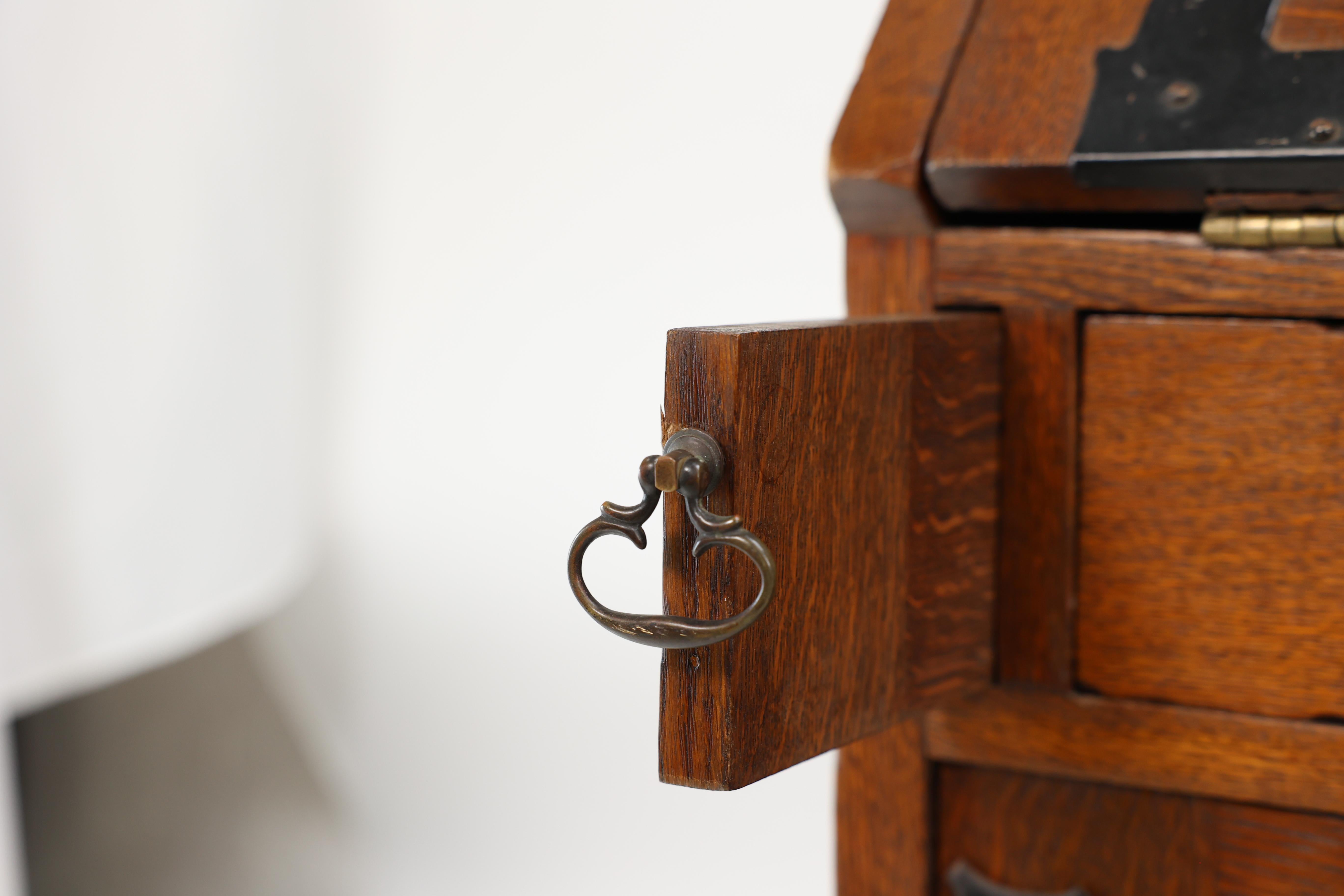 Leonard Wyburd for Liberty & Co. An Arts & Crafts oak bureau with iron hinges For Sale 11