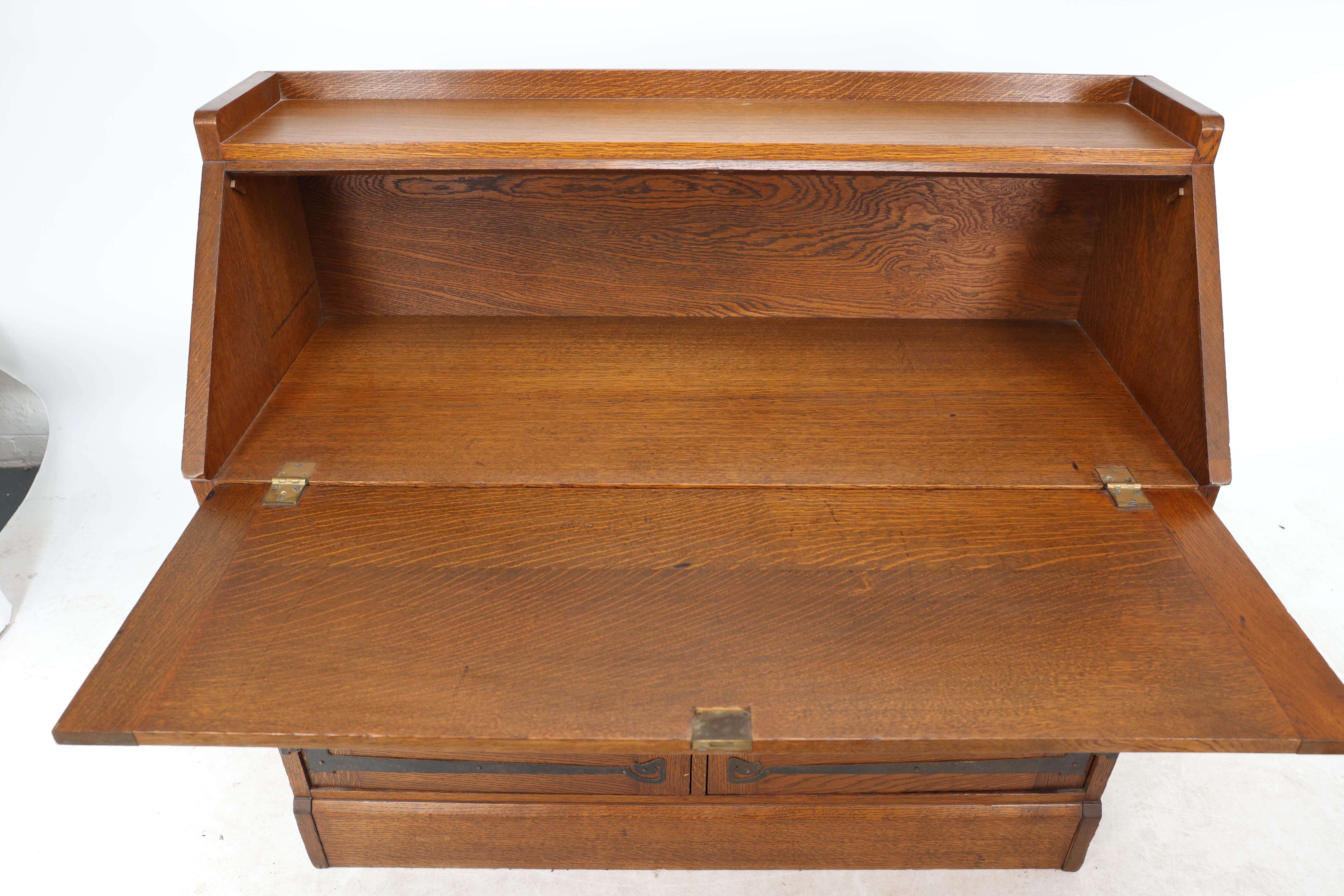 Leonard Wyburd for Liberty & Co. An Arts & Crafts oak bureau with iron hinges For Sale 12