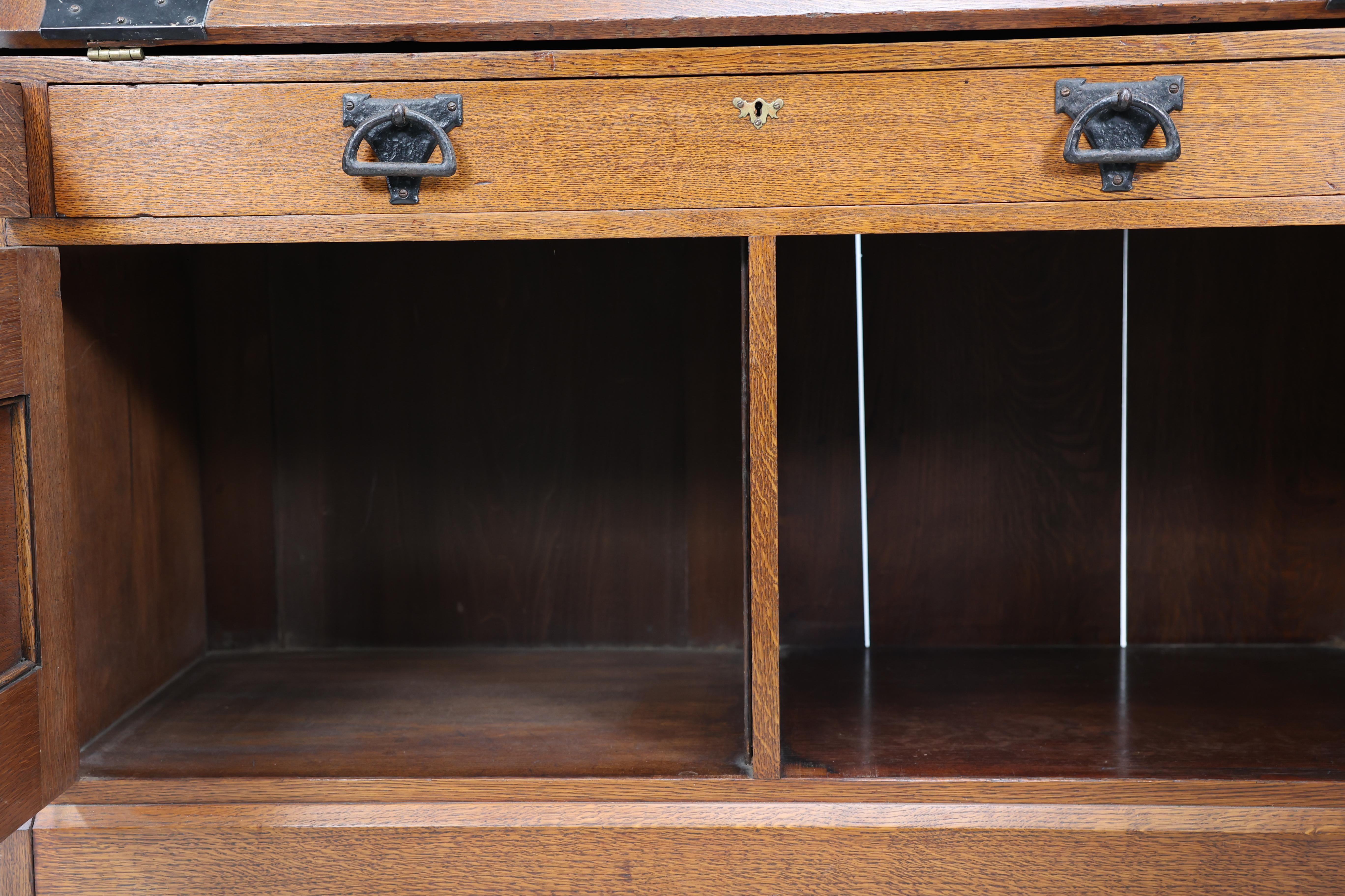 Leonard Wyburd for Liberty & Co. An Arts & Crafts oak bureau with iron hinges For Sale 13