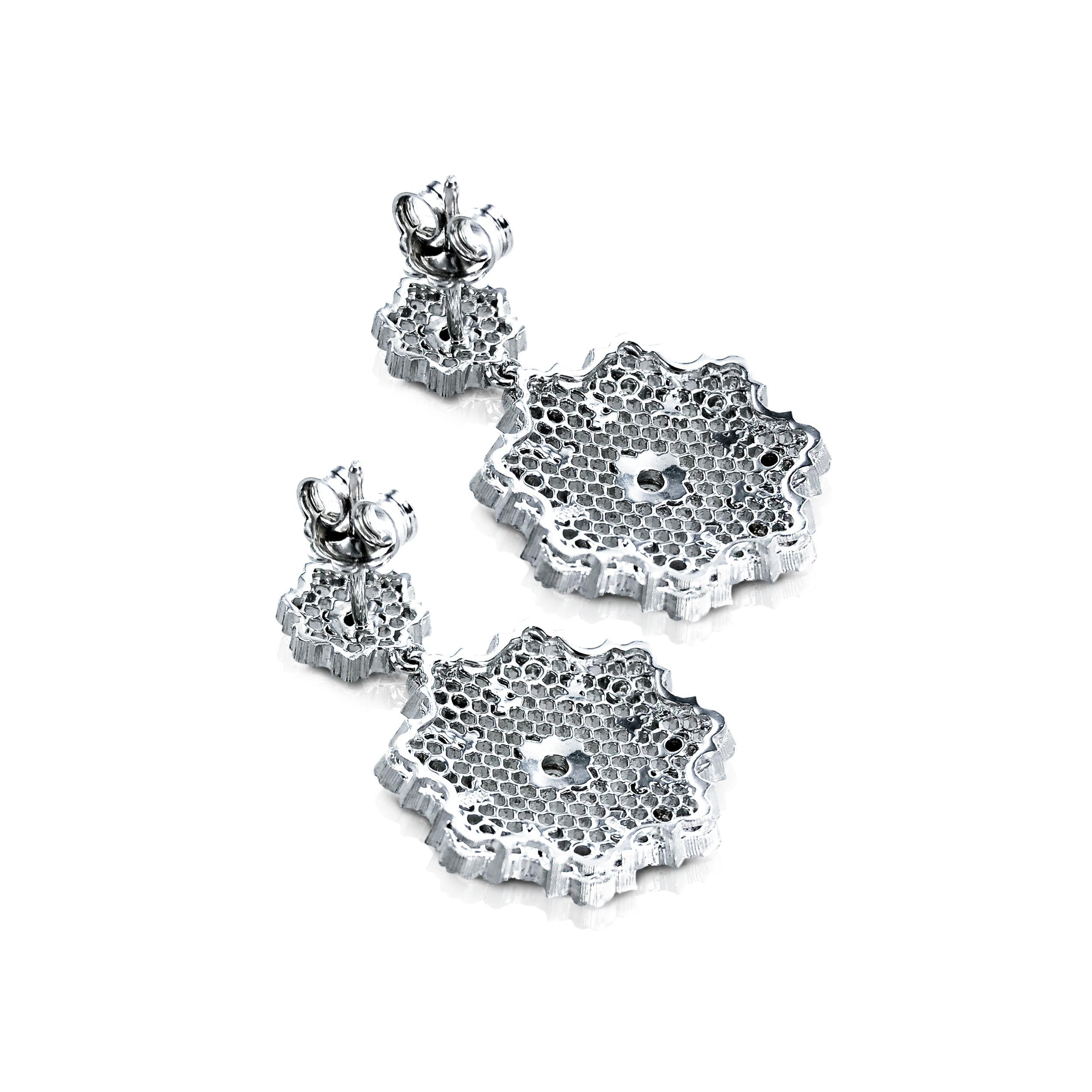 These Diamond 0.52 Carat 18Kt White Gold Dangling Earrings were designed and inspired by Leonardo da Vinci's architectural drawings, and incorporate the patented Leonardo da Vinci Cut Diamond.

Set in 18kt white Gold, the beautiful octagon shaped