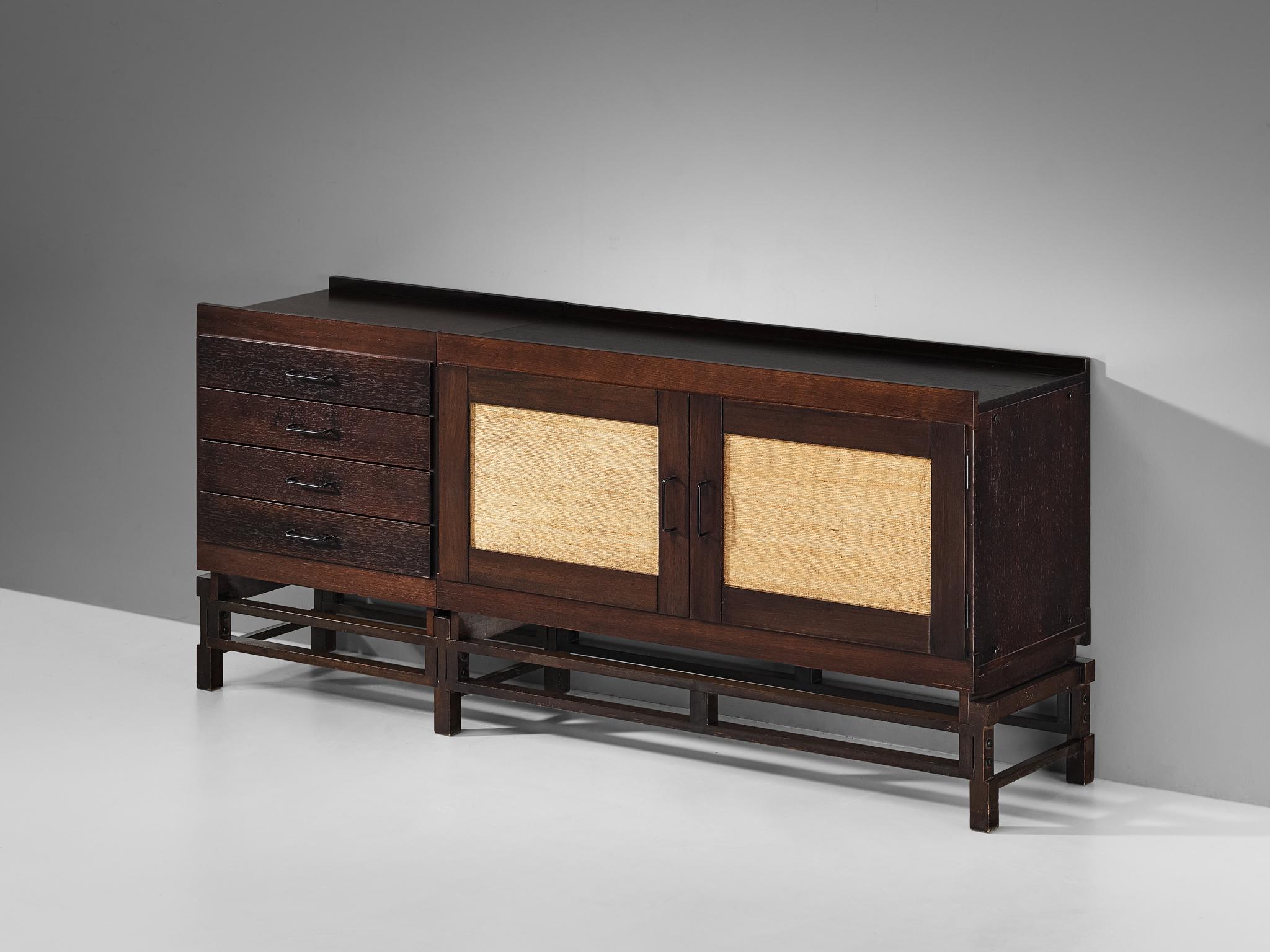 Leonardo Fiori for ISA Bergamo, sideboard, stained oak, seagrass, metal, Italy, 1950s

Beautiful sideboard designed by Leonardo Fiori for ISA Bergamo. The combination of the intense dark stained oak and the refined woven seagrass results in an