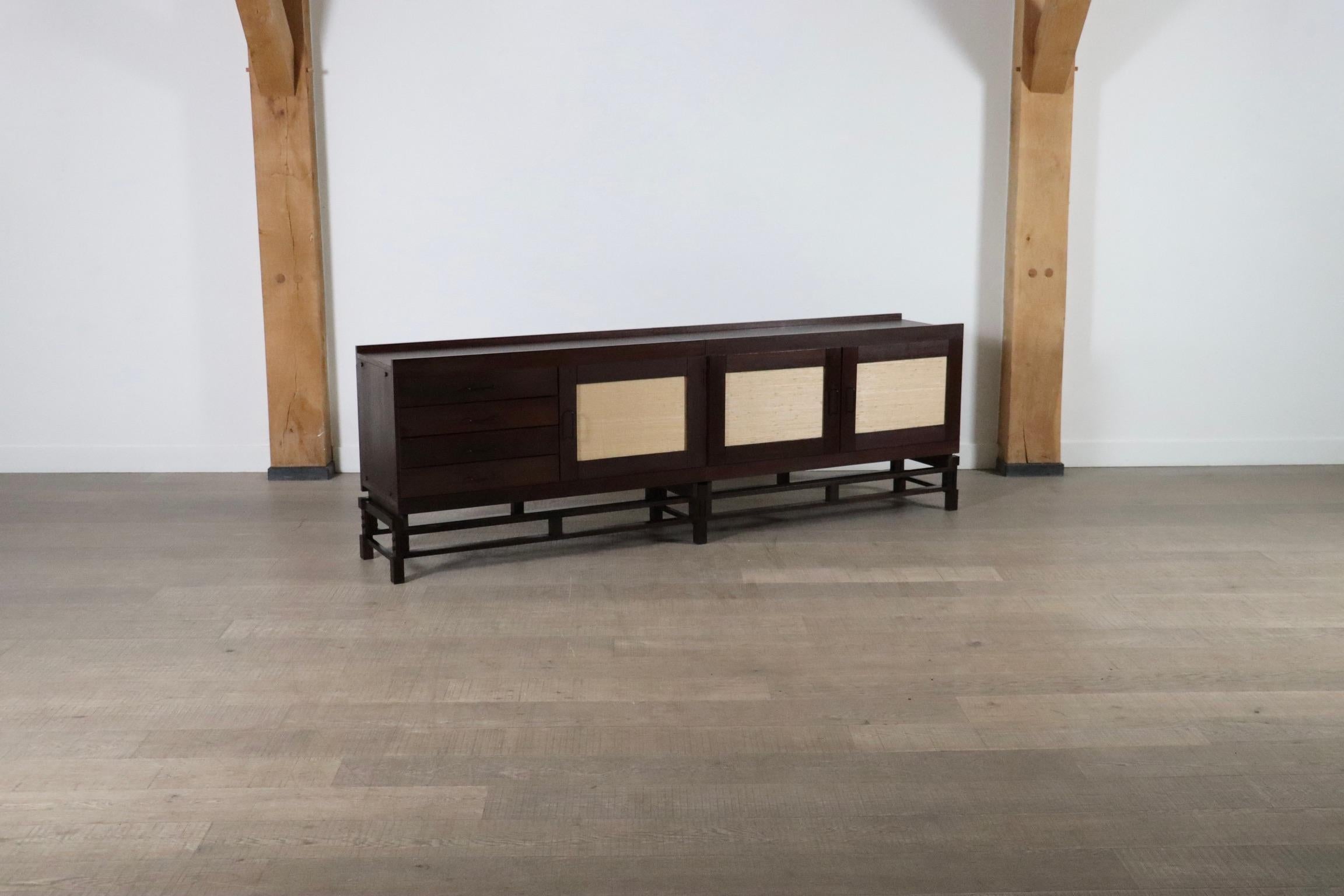 Incredible sideboard, designed by Leonardo Fiori for ISA Bergamo in wengé, seagrass, steel, brass, Italy, 1950s

The combination of the wengé and the refined woven seagrass creates a natural, yet luxurious look. This sideboard features three doors,