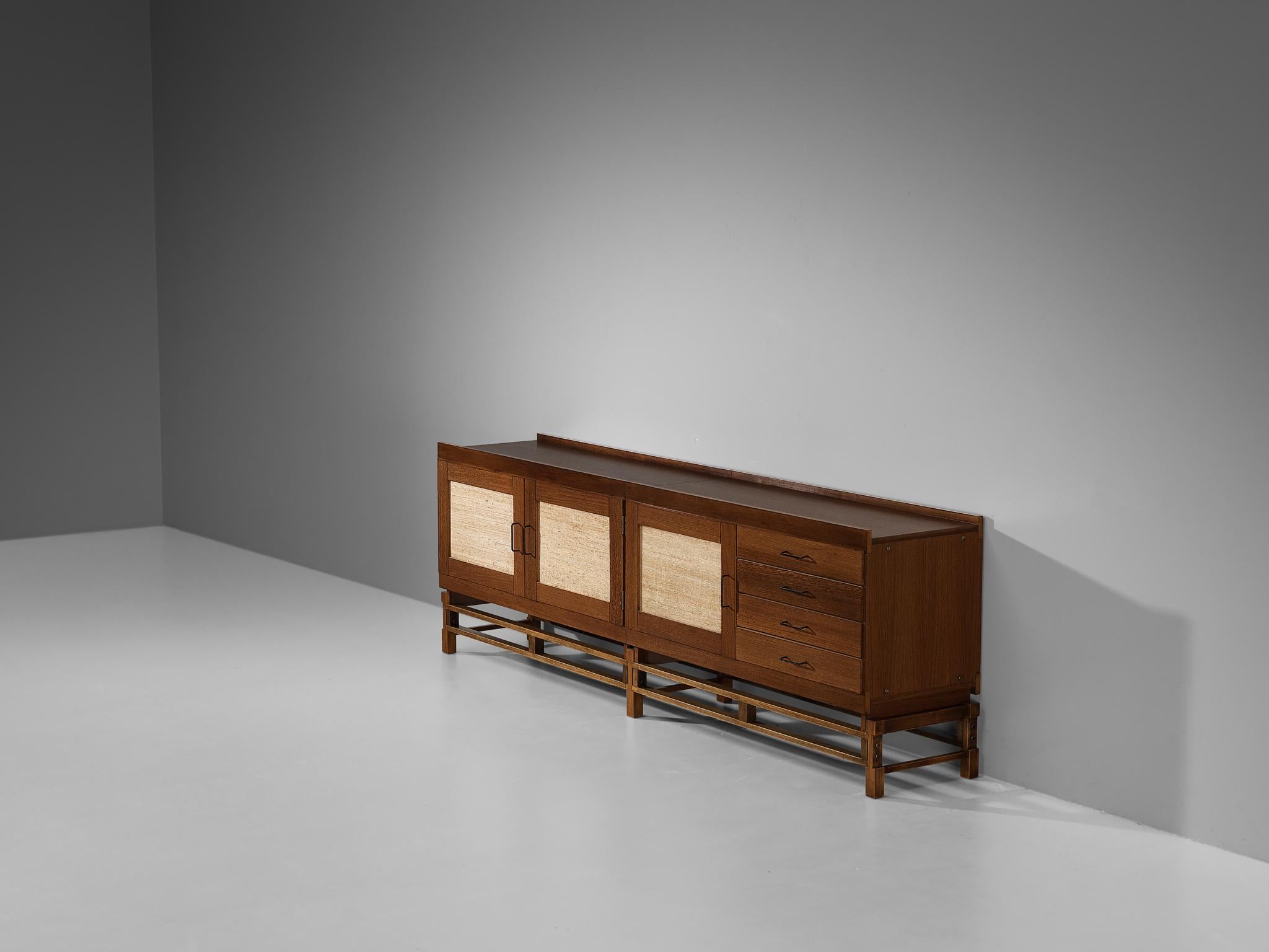 Leonardo Fiori for ISA Bergamo, sideboard, wengé, seagrass, steel, brass, Italy, 1950s

Beautiful cabinet designed by Leonardo Fiori for ISA Bergamo. The combination of the wengé and the refined woven seagrass results in an exotic and luxurious
