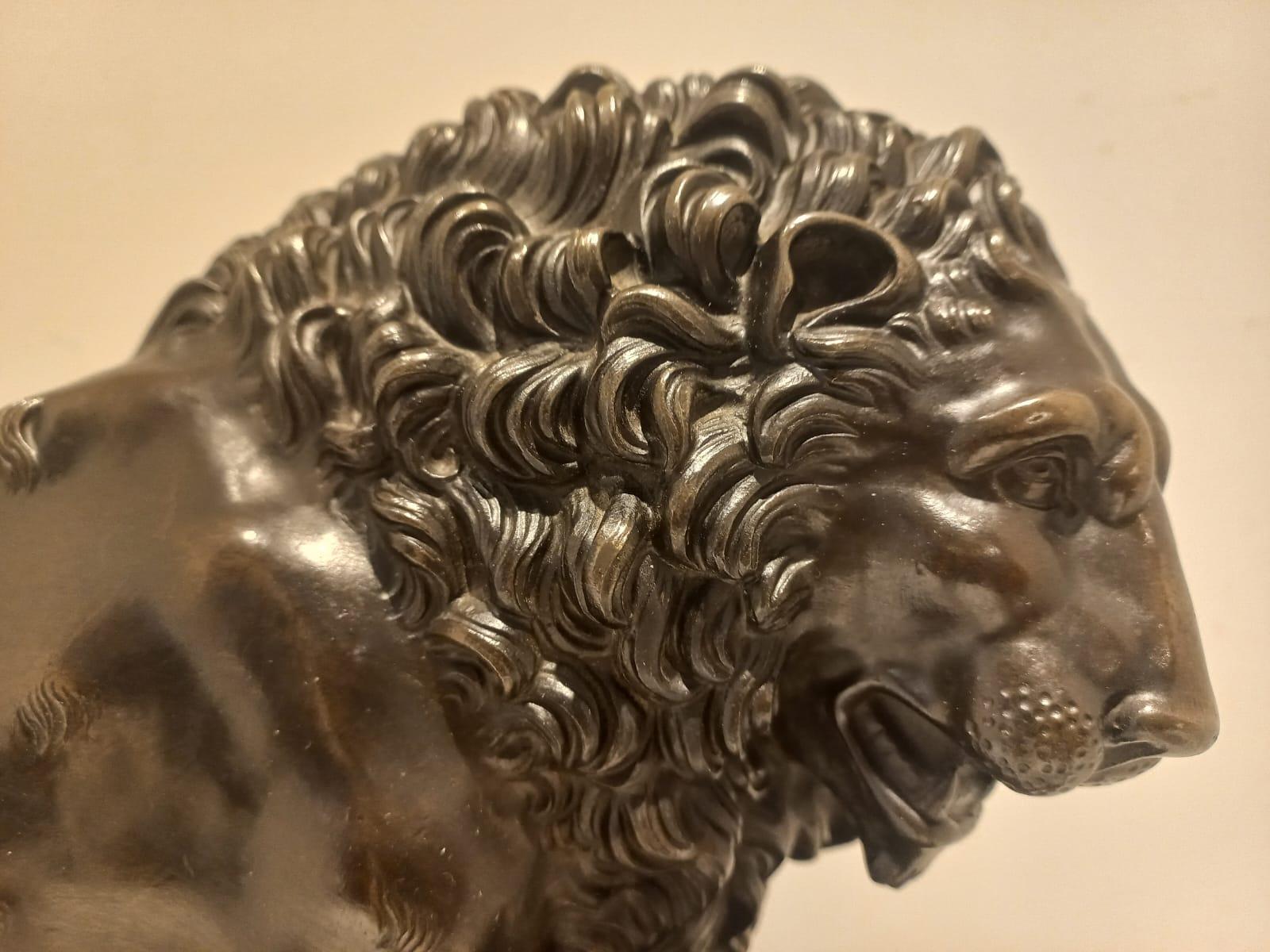 Lion with paw on cannonball For Sale 1