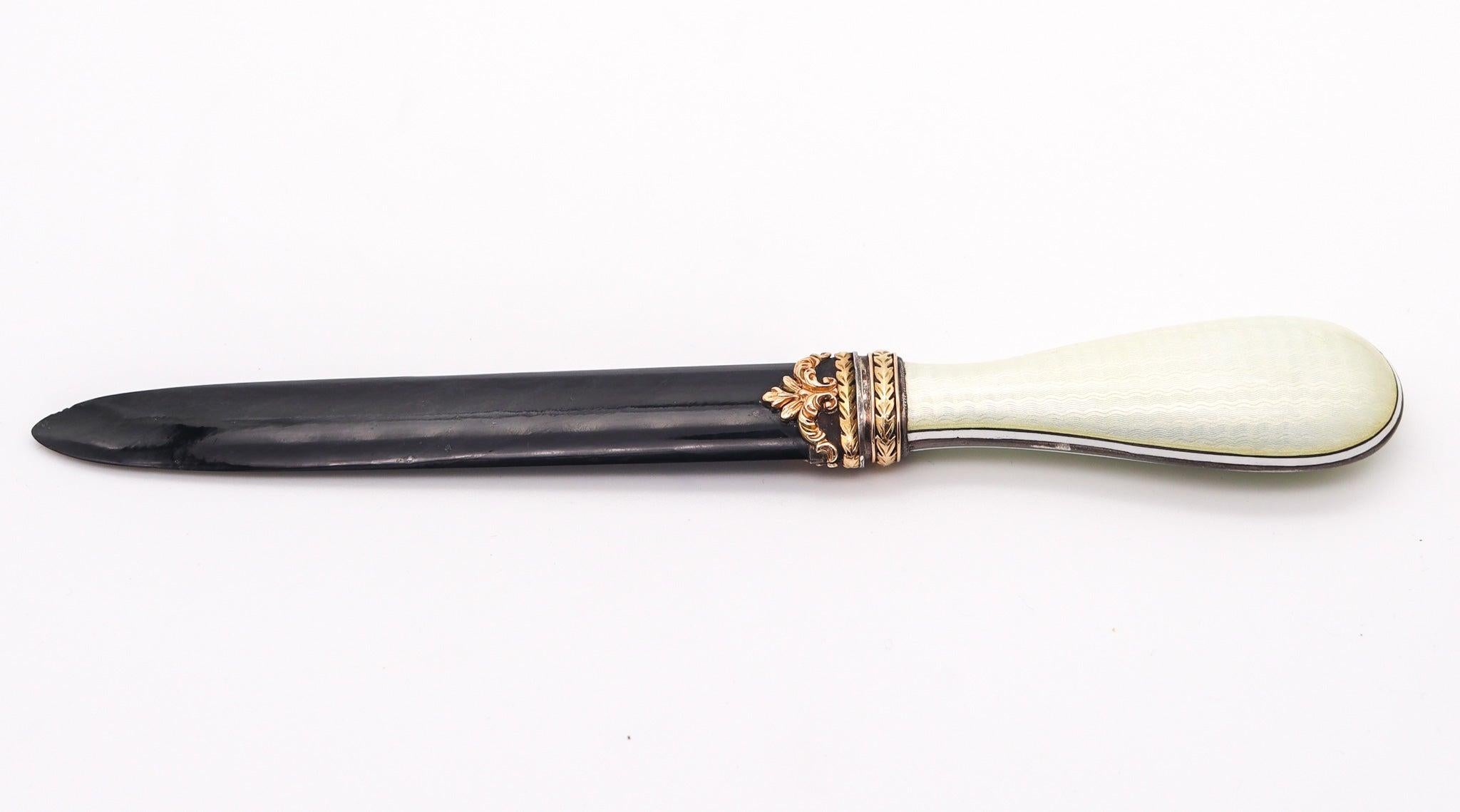 Russian letter opener designed by Leonid Kochergin.

This is a very handsome luxurious desk letter-opener, created during the imperial Russian period in the city Saint Petersburg, between the 1900 and 1910. The fabulous neo-classic piece has been