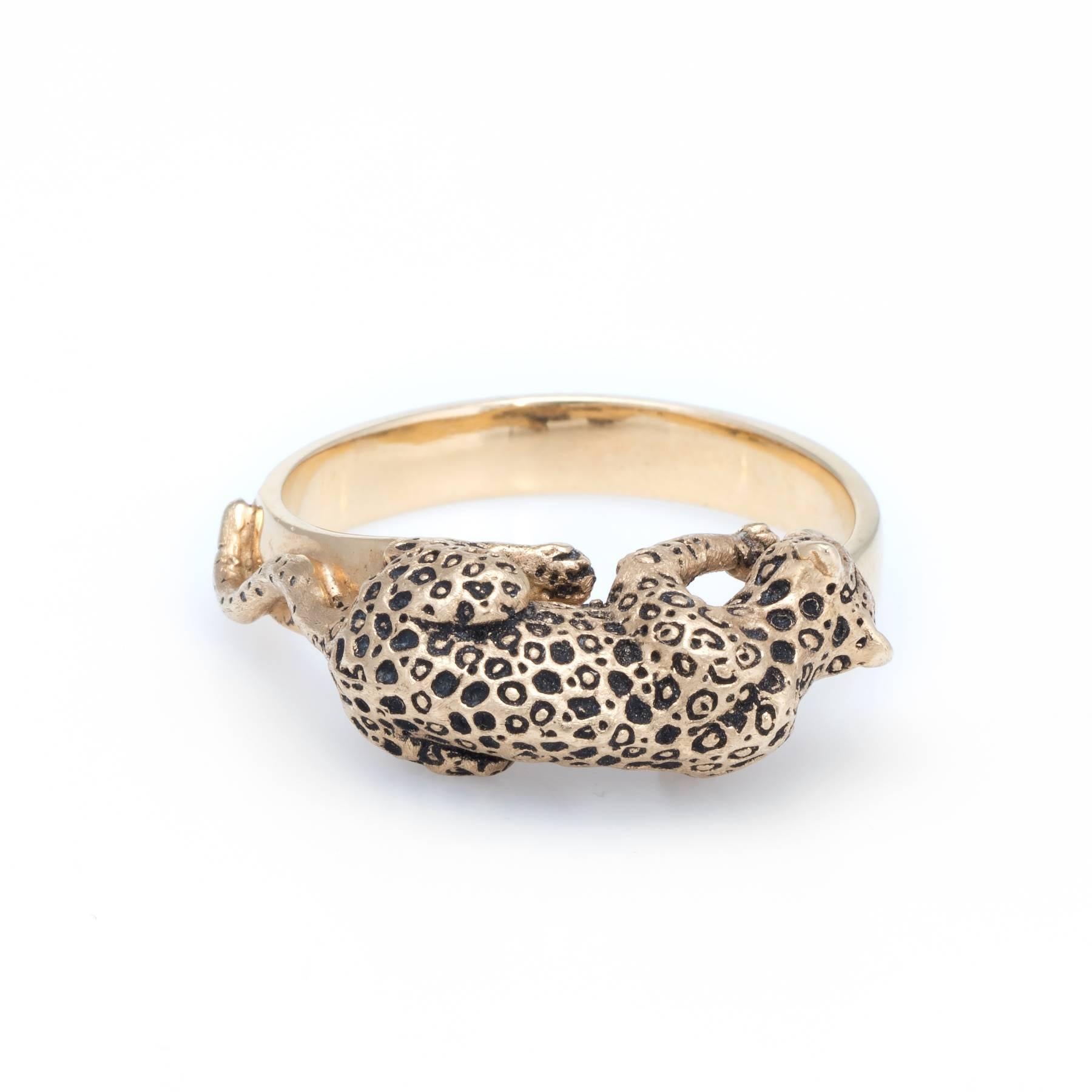 Finely detailed vintage Leopard ring, crafted in 14 karat yellow gold. 

A leopard with black enamel spots is perched on top of the band.   

The ring is in very good condition. 

Particulars:

Weight: 9.9 grams

Stones:  N/A.

Size & Measurements:
