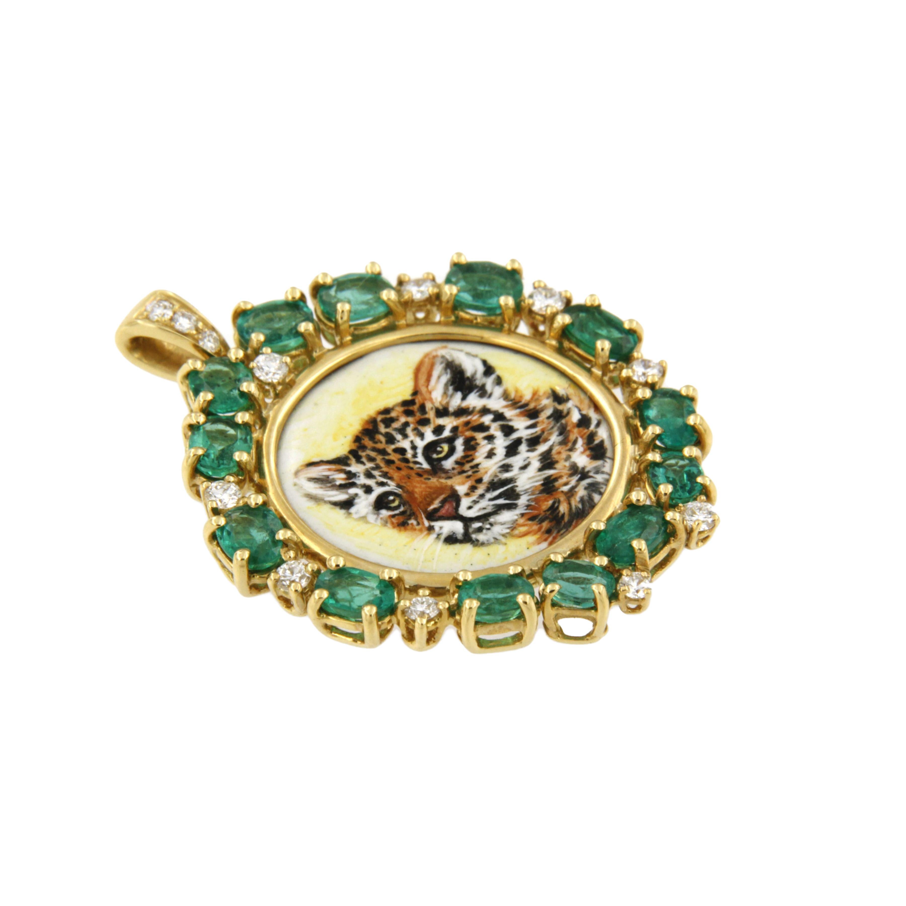 This 18K yellow gold pendant features a leopard cub that is hand-painted in enamel by our artisan in Milan, Italy. The pendant has a halo of oval cut emeralds and brilliant cut white diamonds. 

A luxury gift idea for the animal lover or big cat