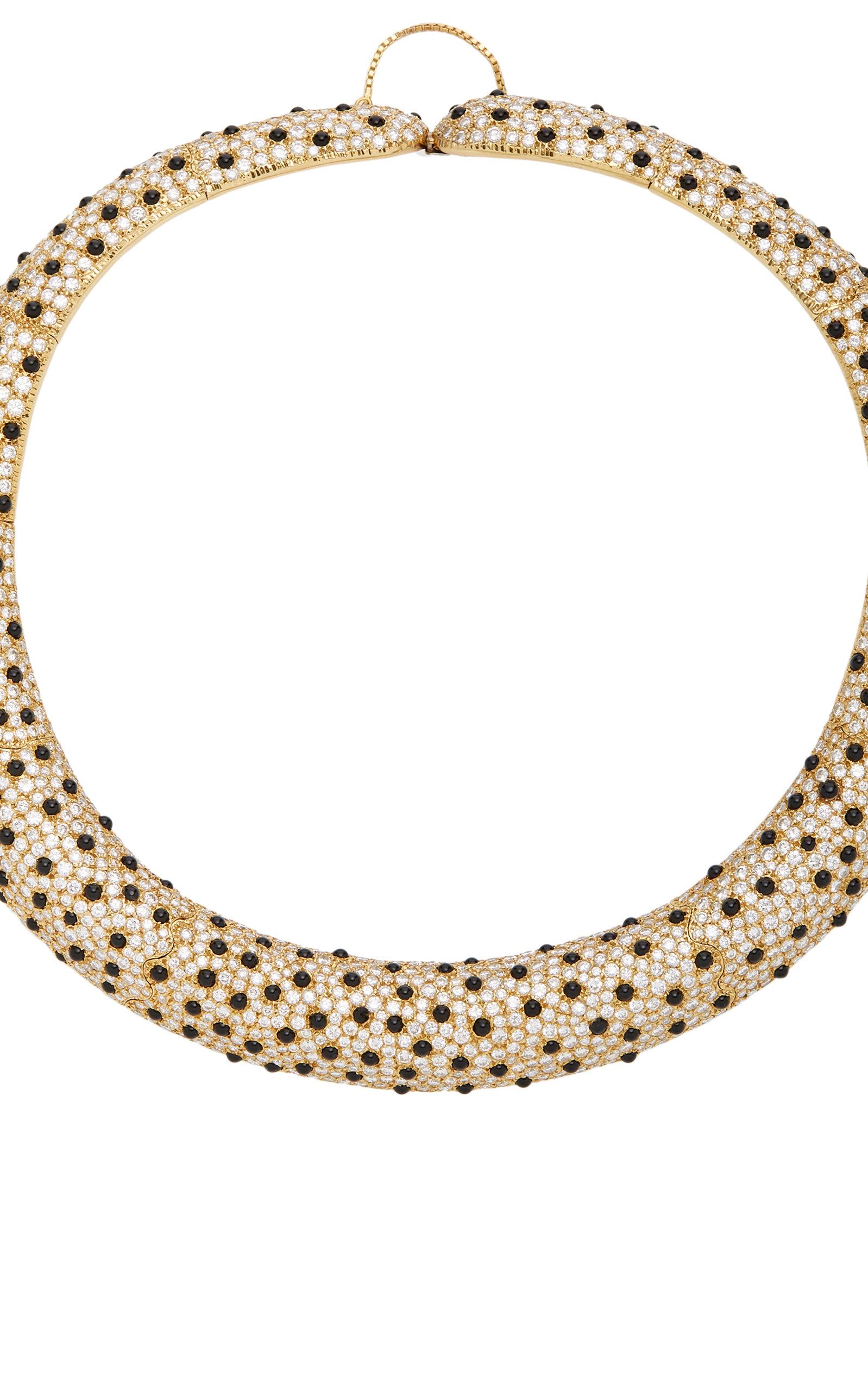 A Leopard inspired collar necklace in 18kt yellow gold with round brilliant cut diamonds and onyx. Made in Italy, circa 1980s.   
