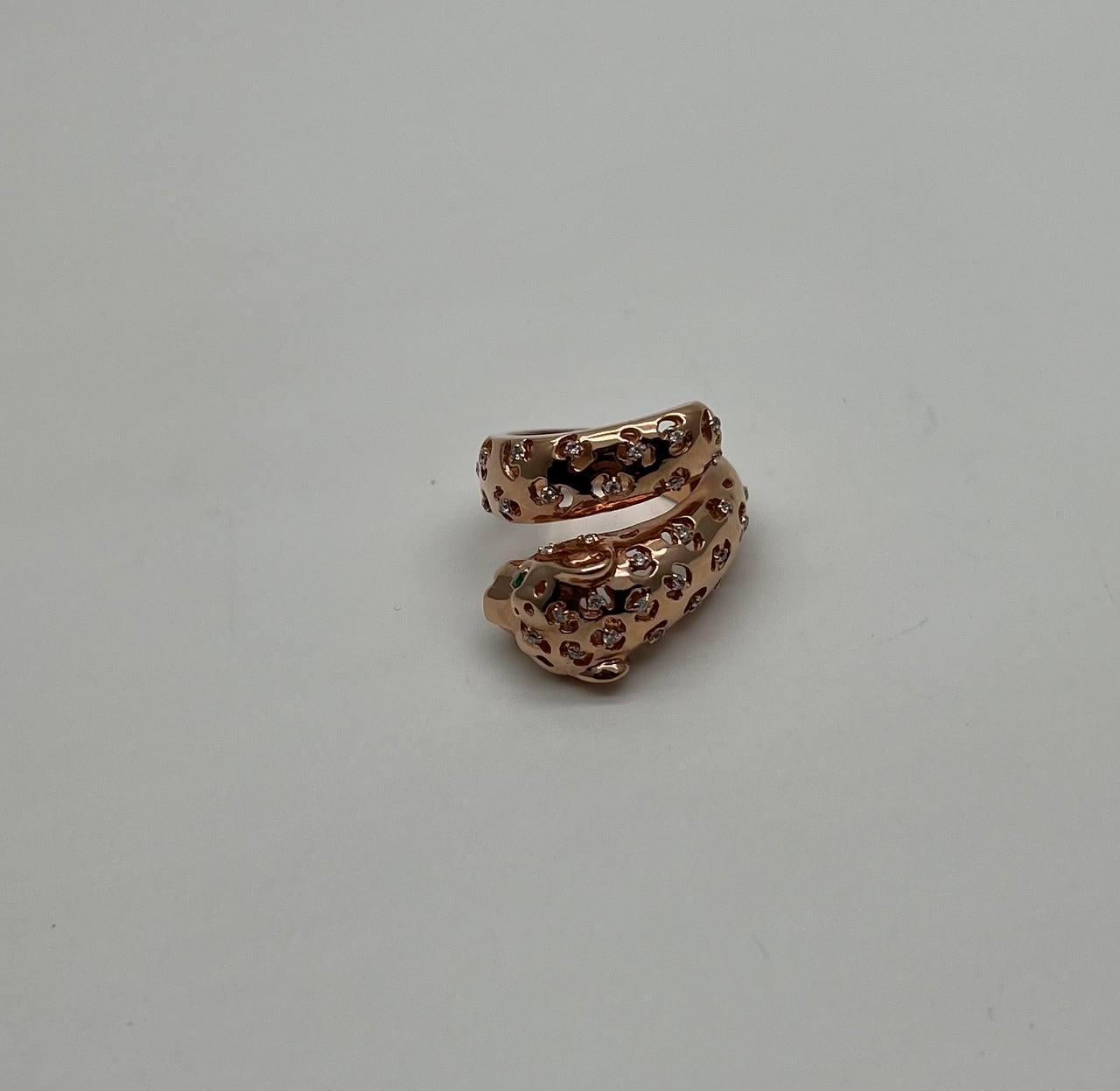 A striking ring, this exquisite piece features a captivating design in rose gold. The ring is intricately crafted to resemble a coiled panther leopard lion, with detailed texture and body shape adorned with sparkling accent diamonds. The head of the