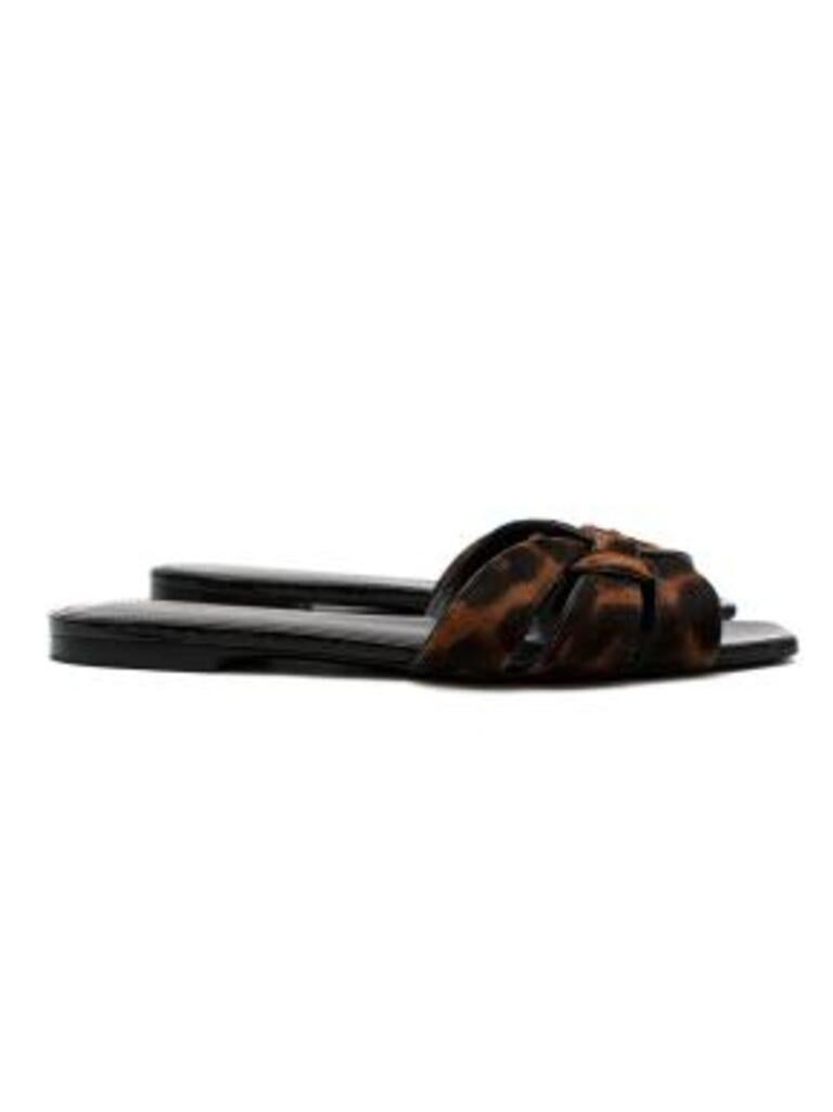 Saint Laurent Leopard print calf hair Tribute flat sandals
 
 -Sleek woven straps and square toes
 -Slight heel
 -Leopard-print calf hair
 -Supple leather linings
 -Slip on 
 
 Material:
 
 Leather
 Calf hair 
 
 Made in Italy
 9/10 excellent