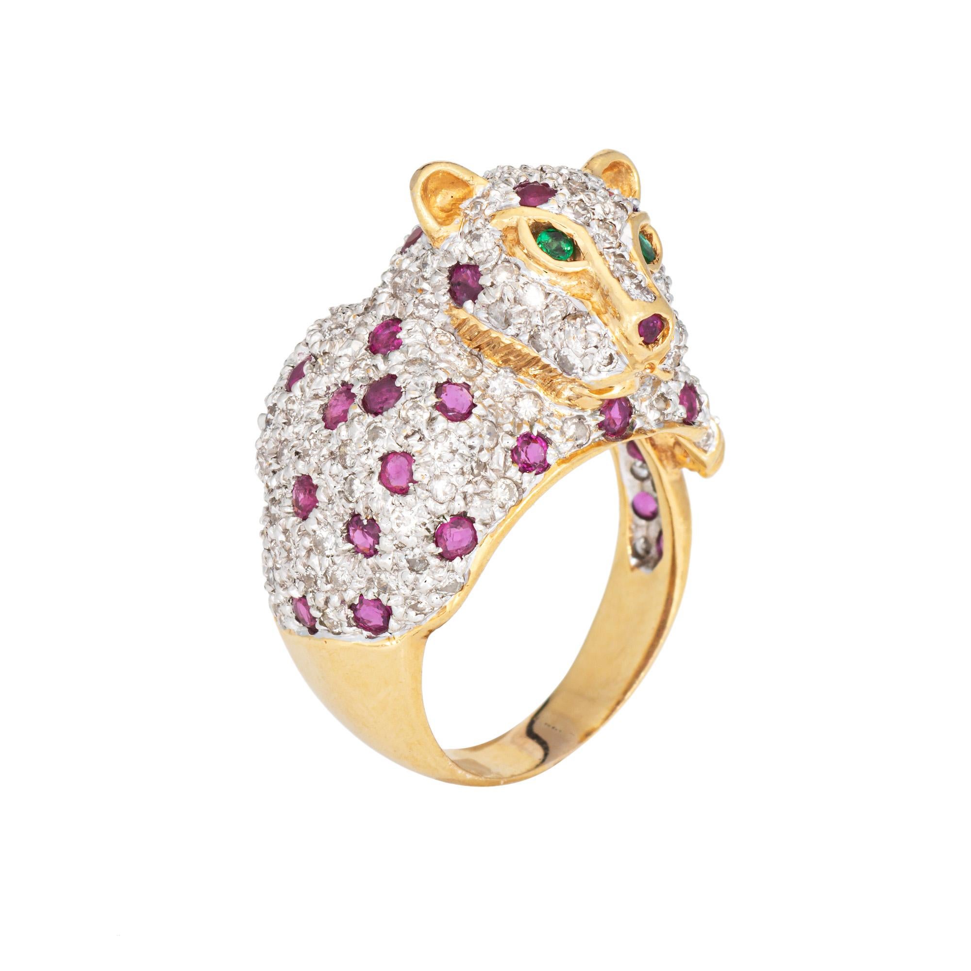 Finely detailed vintage leopard ring crafted in 18k yellow gold (circa 1970s to 1980s).  

Diamonds total an estimated 0.50 carats (estimated at H-I color and SI2-I1 clarity). Rubies measure approx. 1.5mm each. Two emeralds measure approx. 1mm (set