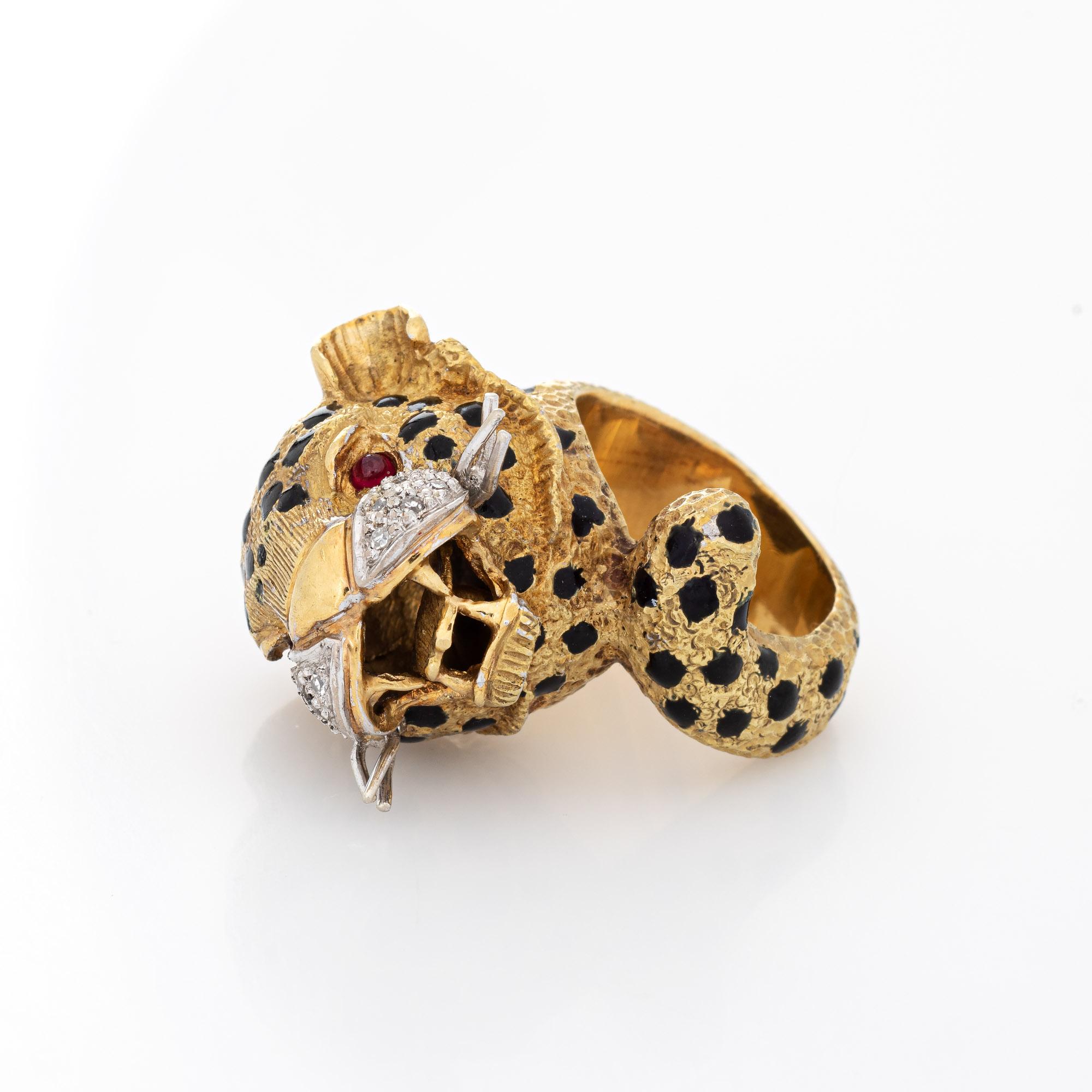 Finely detailed vintage leopard ring crafted in 18k yellow gold (circa 1960s to 1970s).  

Ten single cut diamonds total an estimated 0.05 carats (estimated at H-I color and SI1-2 clarity). Two estimated 0.02 carat cabochon cut rubies are set into