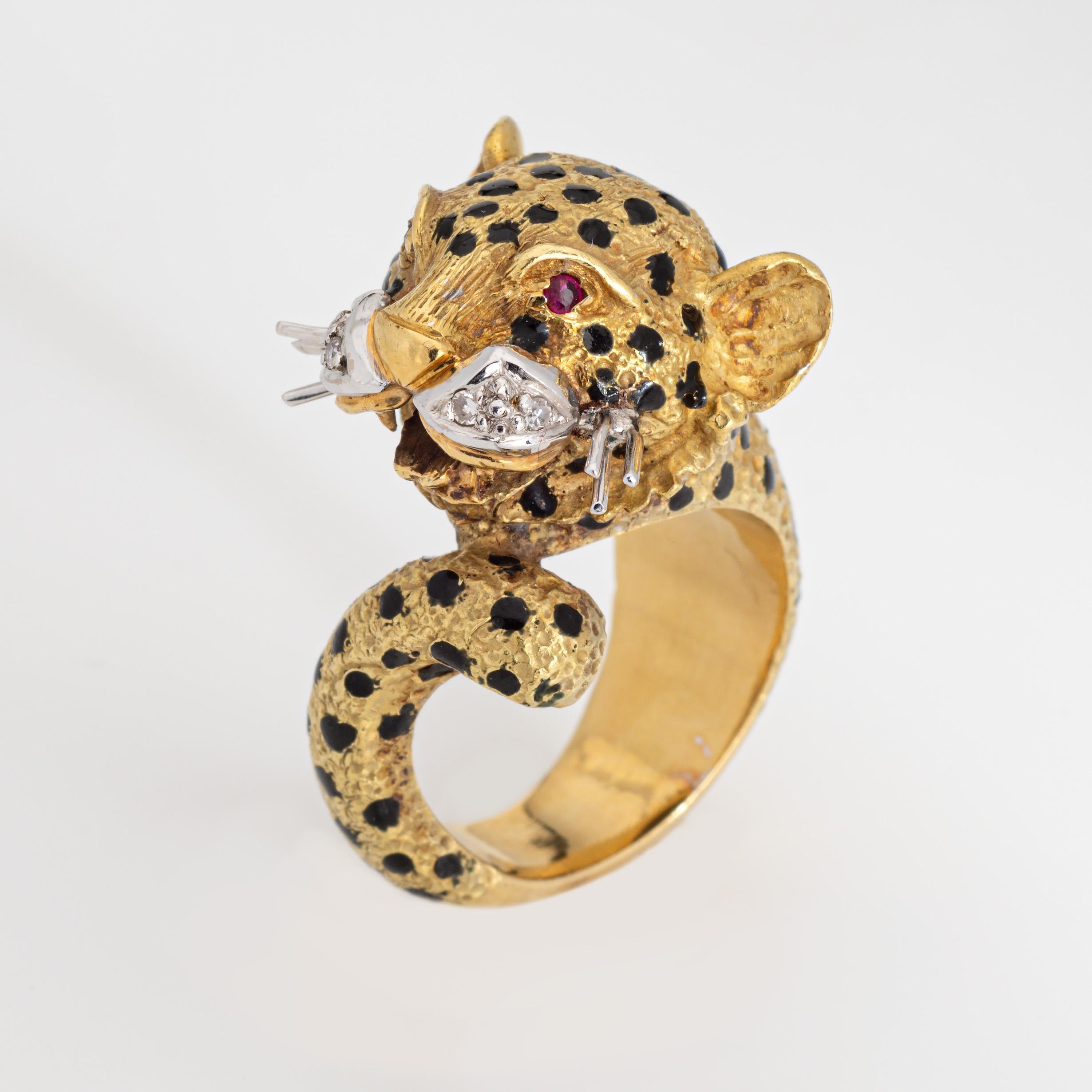 Finely detailed vintage leopard ring crafted in 18k yellow gold (circa 1960s to 1970s).  

4 diamonds total an estimated 0.02 carats (estimated at H-I color and SI2-I1 clarity). Two estimated 0.01 carat cut rubies are set into the eyes. 

The