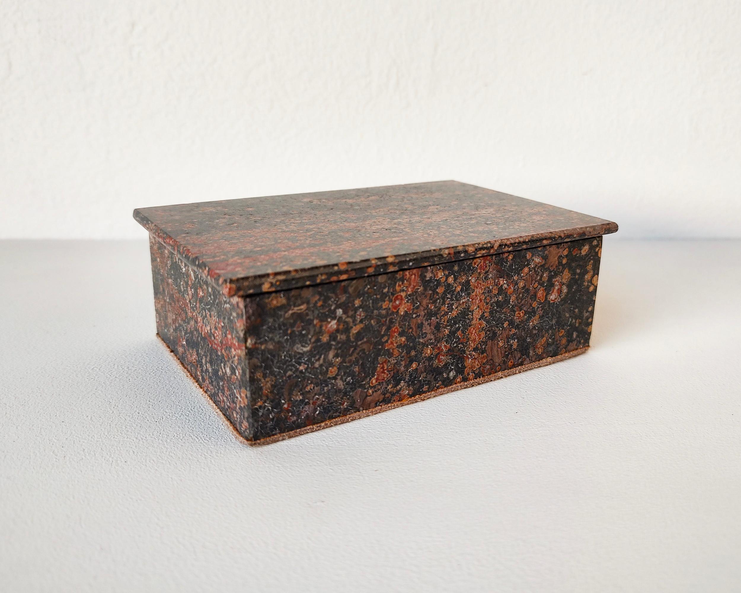 Beautiful lidded stone box made from polished slabs of leopard spot jasper stone. Trimmed with tan suede inside and on the bottom. Triangle pieces on the inside of the lid help to line up the lid for a nice fit. Lid rests on top and does not have