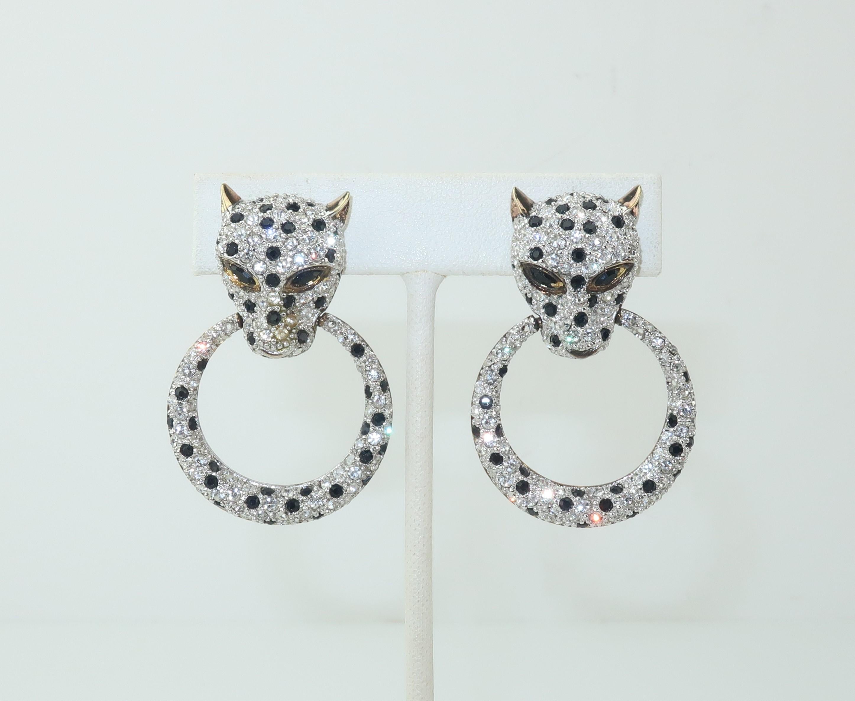 These C.1980 clip on earrings are fabricated from gilt sterling silver and feature leopards embellished with sparkling crystal clear and black rhinestones suspending articulated door knocker rings.  ‘Purrrrfect’ for adding a glamorous touch to your