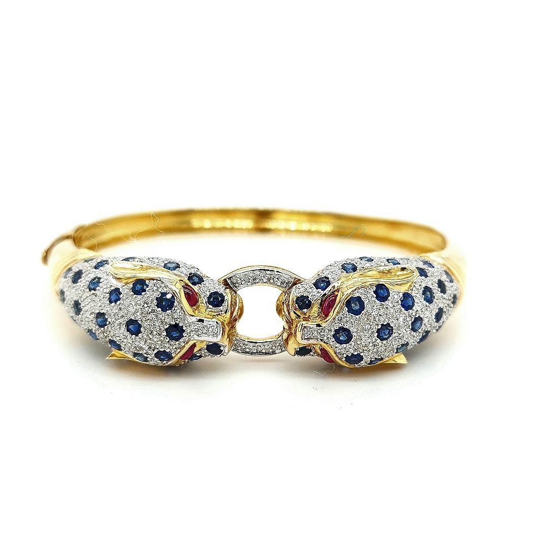 18kt Yellow Gold Leopard Bracelet/Bangle with Diamonds, Sapphires, Rubies

Stunning bangle bracelet set with diamonds, sapphires and rubies. with two leopards facing each other.

Even though Leopards are strong powerful animals and like to spend in