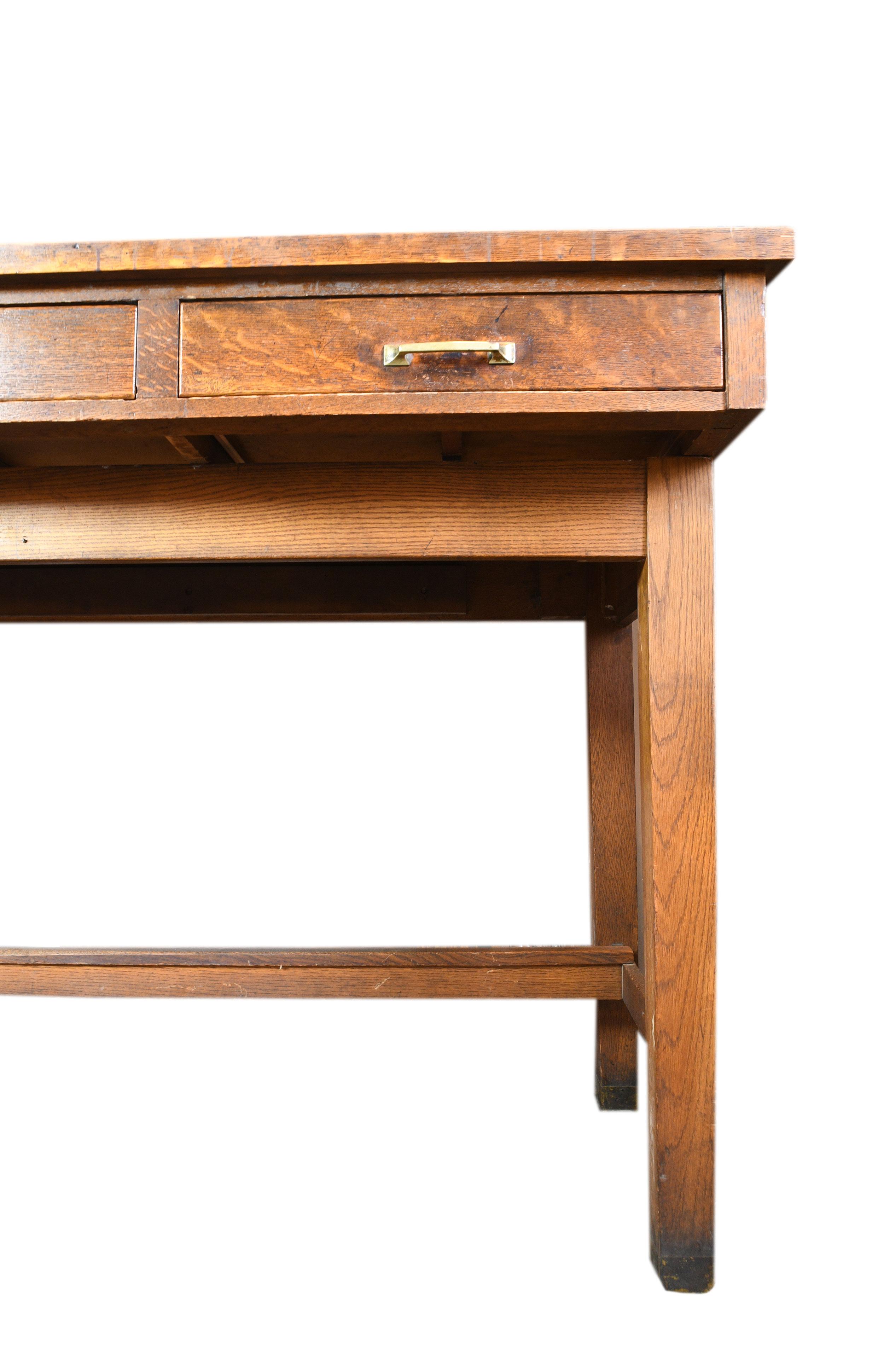 This enormous Leopold Desk Company standing desk is made of lovely oak and features four deep drawers affording ample storage space. The Leopold Desk Company was an office furniture manufacturing firm in Burlington, Iowa. In it’s prime, the company