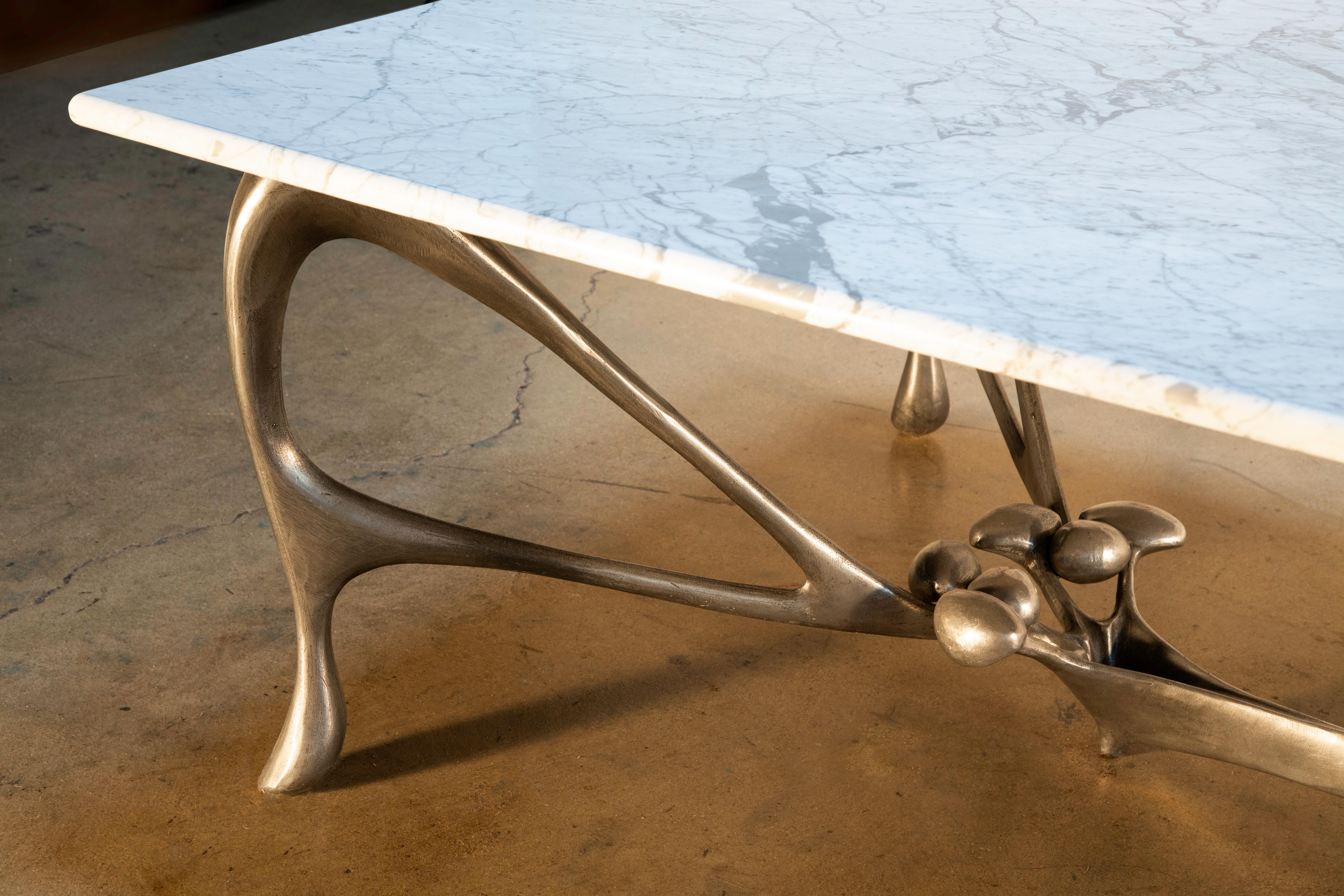 Leopold Blooming in paradise conference / dining table, by Jordan Mozer, Chicago, 2018. 
Cast, handworked and burnished aluminum-magnesium and highly figured Carrara marble with a matte polished finish. 
Provenance: Collection of the artist.
