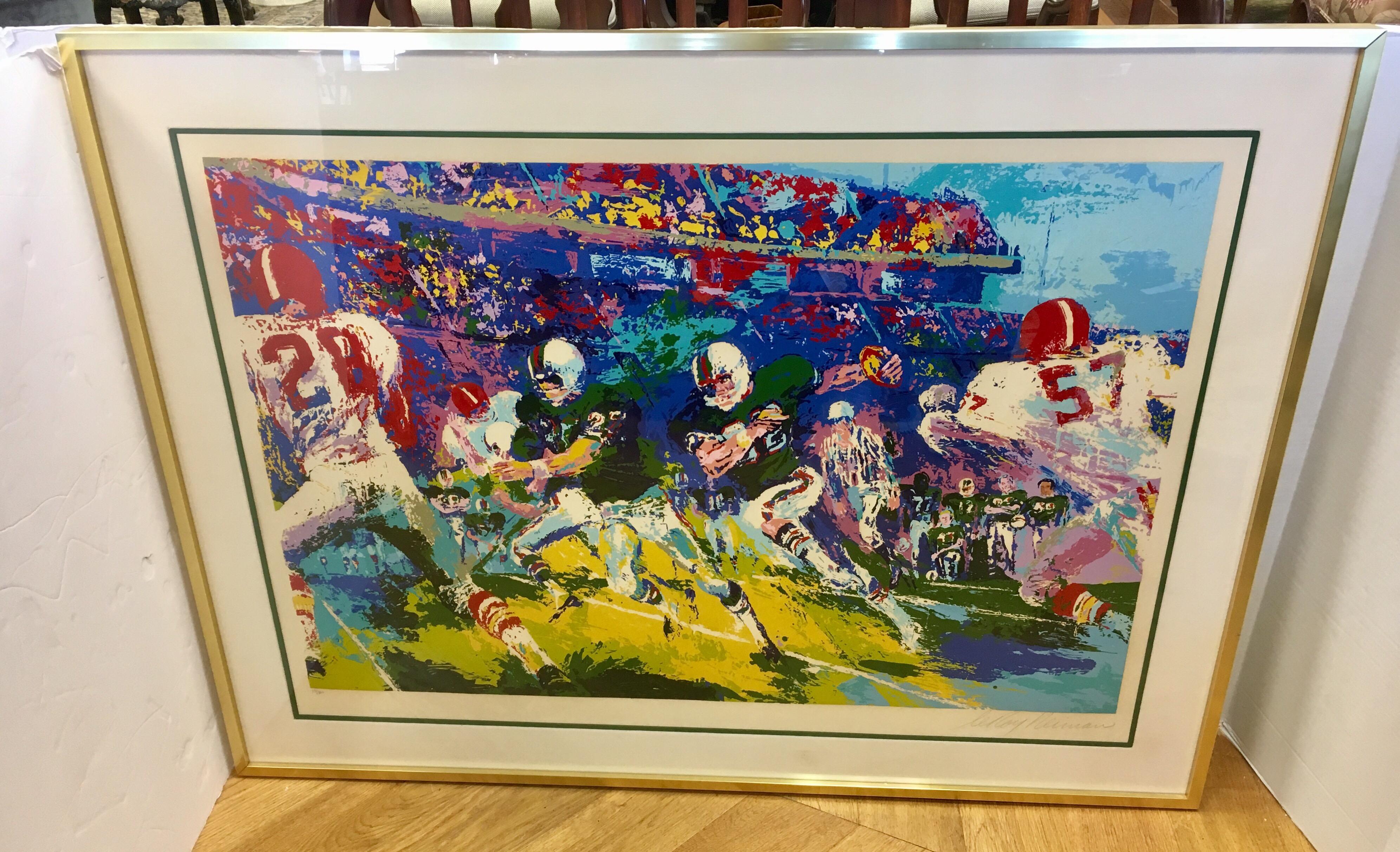 Coveted Leroy Neiman signed in pencil serigraph of gridiron scene. It is numbered 13 of 300.
It is protected under glass and in very tasteful frame. A big piece with wonderful colors guaranteed to make your room pop!